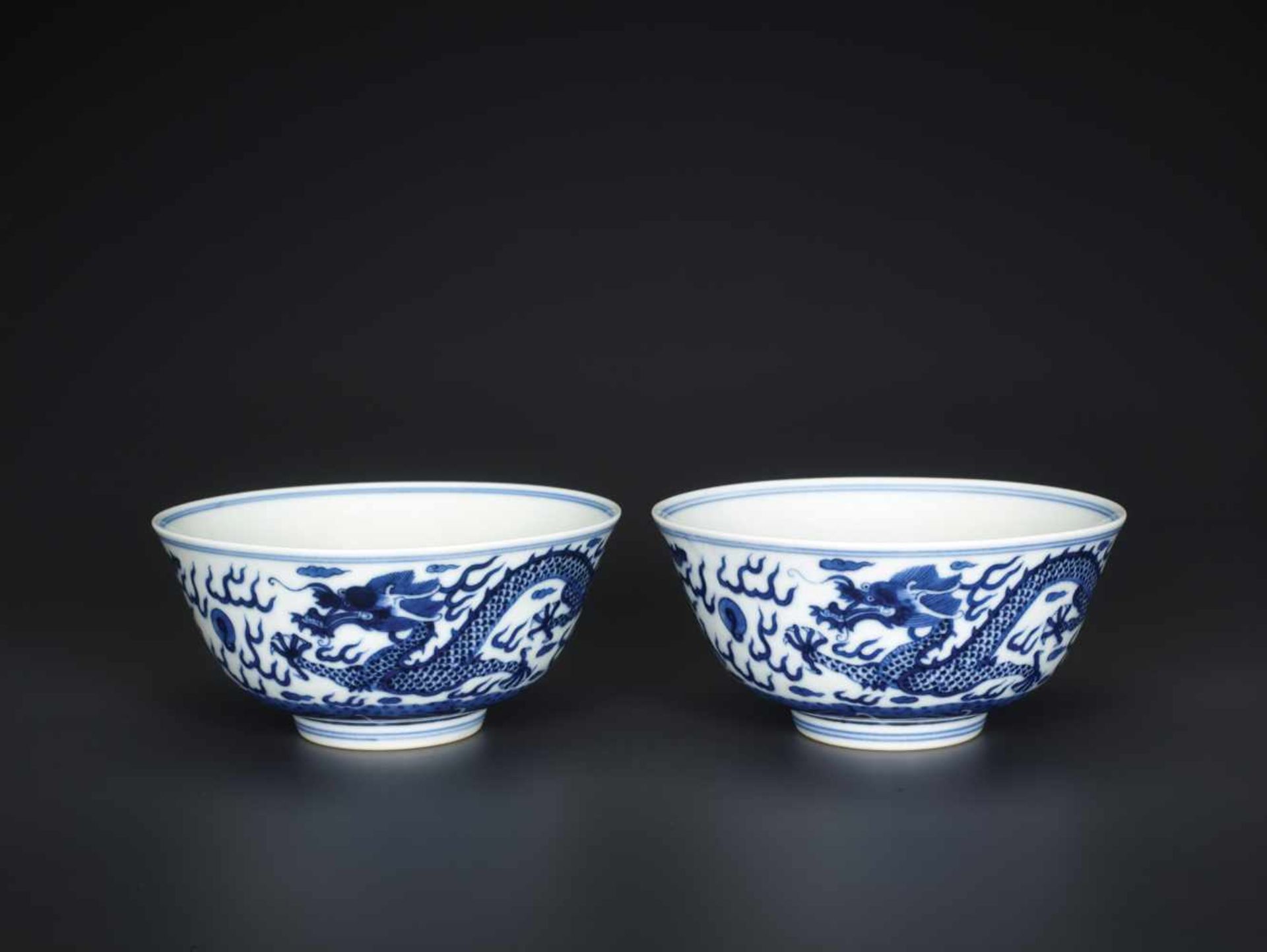 A PAIR OF BLUE AND WHITE 'DRAGON' BOWLS, MARKS AND PERIOD OF GUANGXU Painted in intense and vivid