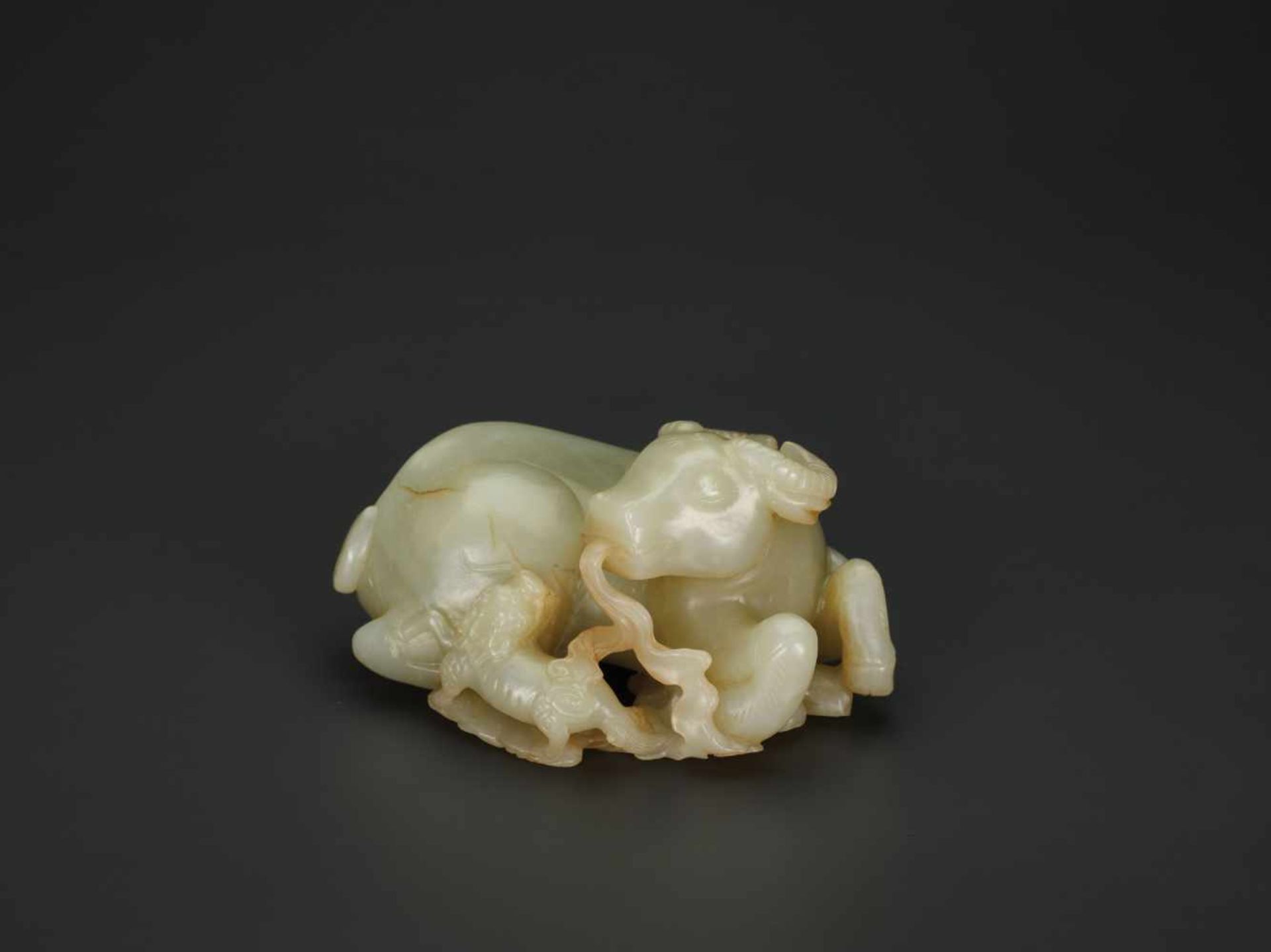 A PALE CELADON JADE 'BUFFALO AND QILIN' GROUP, QIANLONG PERIOD (1736-1795) The pale celadon nephrite