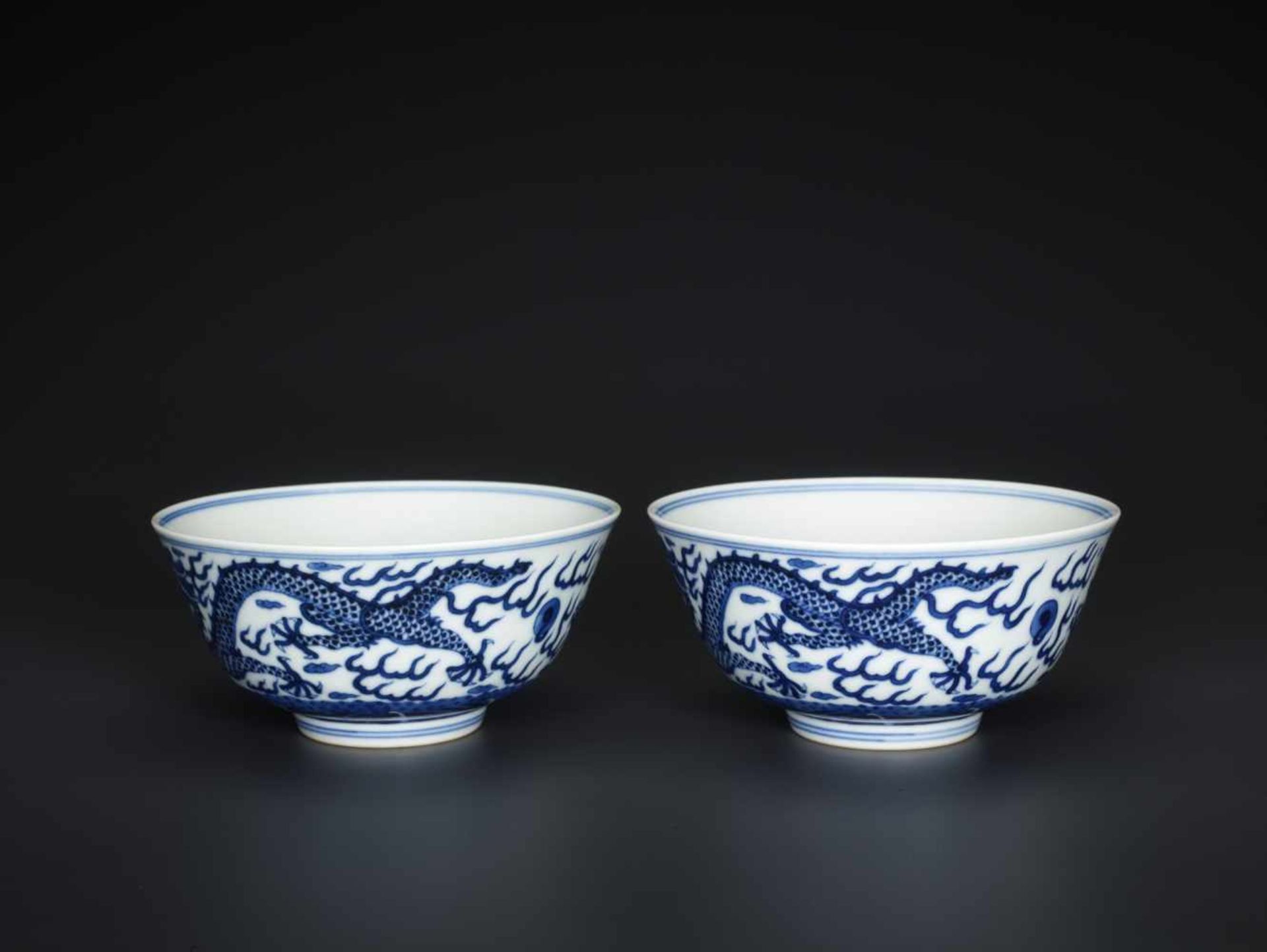 A PAIR OF BLUE AND WHITE 'DRAGON' BOWLS, MARKS AND PERIOD OF GUANGXU Painted in intense and vivid - Image 4 of 5