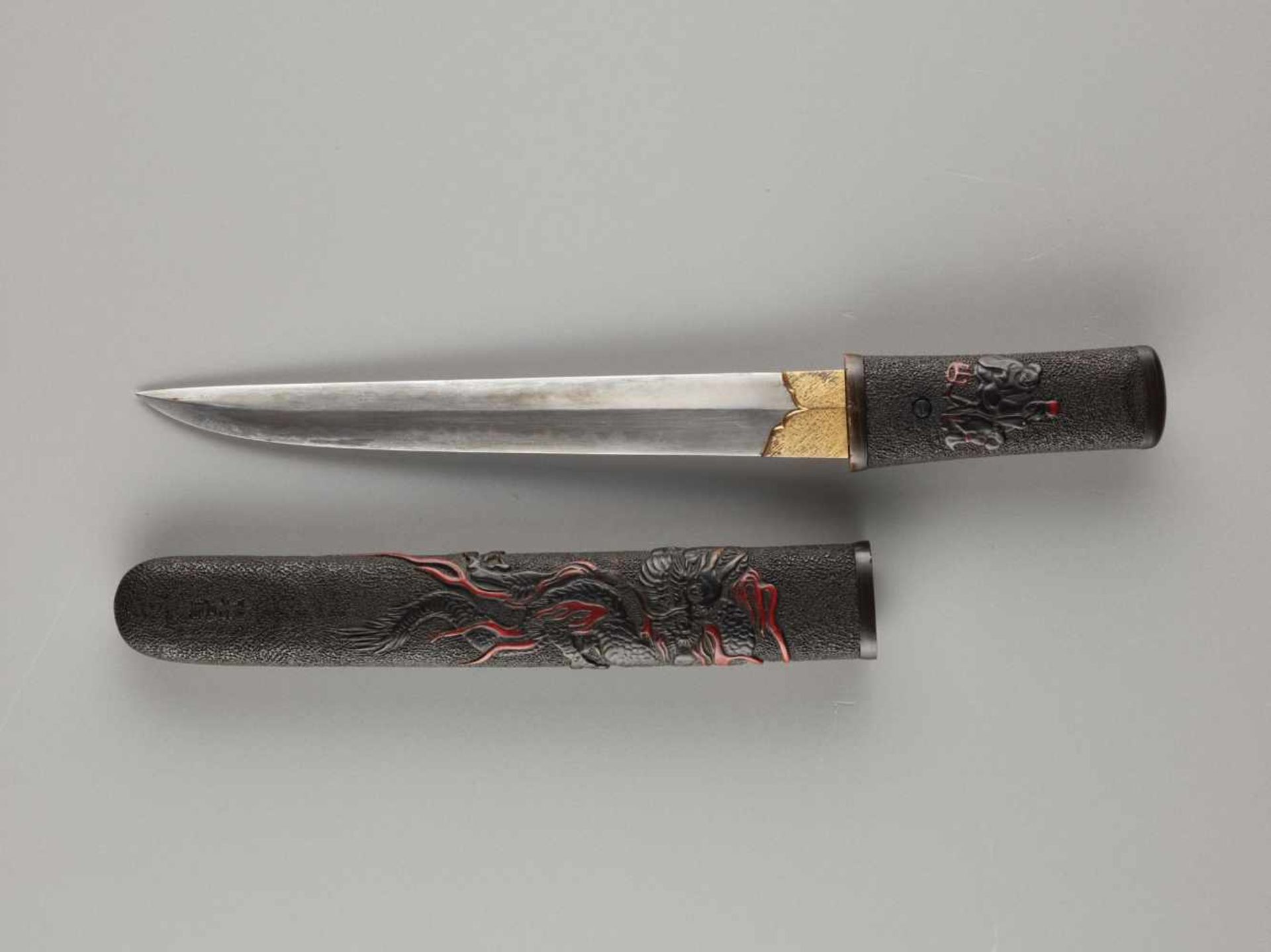 A TANTO IN A LACQUERED SAYA DEPICTING A DRAGON Japan, Edo period (1603 - 1868) (blade and koshirae)