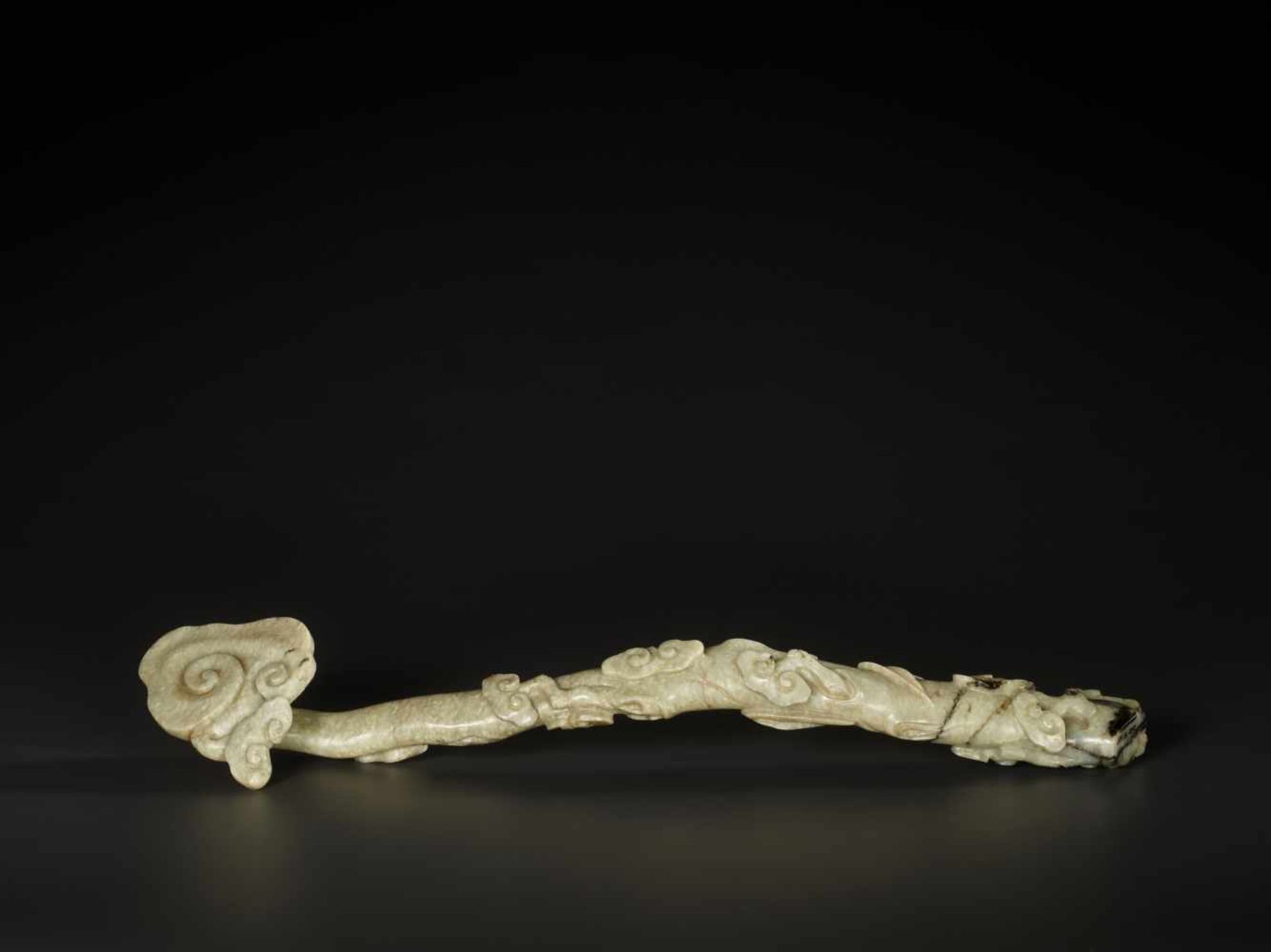 A RARE GREY JADE ‘LINGZHI AND BAMBOO’ RUYI SCEPTER, MING DYNASTY, MUSEUM PROVENANCE The nephrite