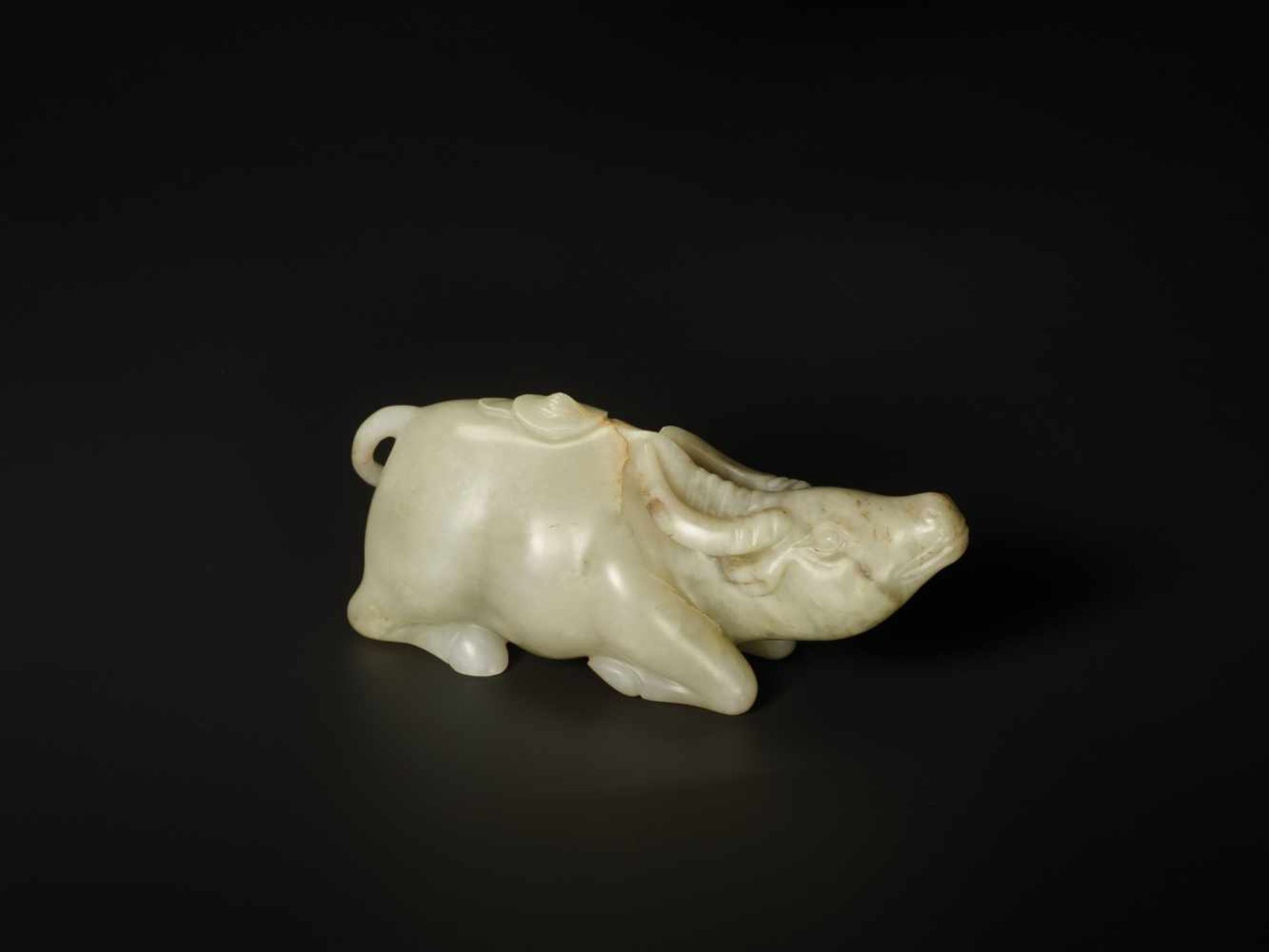 A FINELY CARVED CELADON JADE MODEL OF ‘WATER BUFFALO AND DOULI’ 18TH CENTURY Nephrite of pale