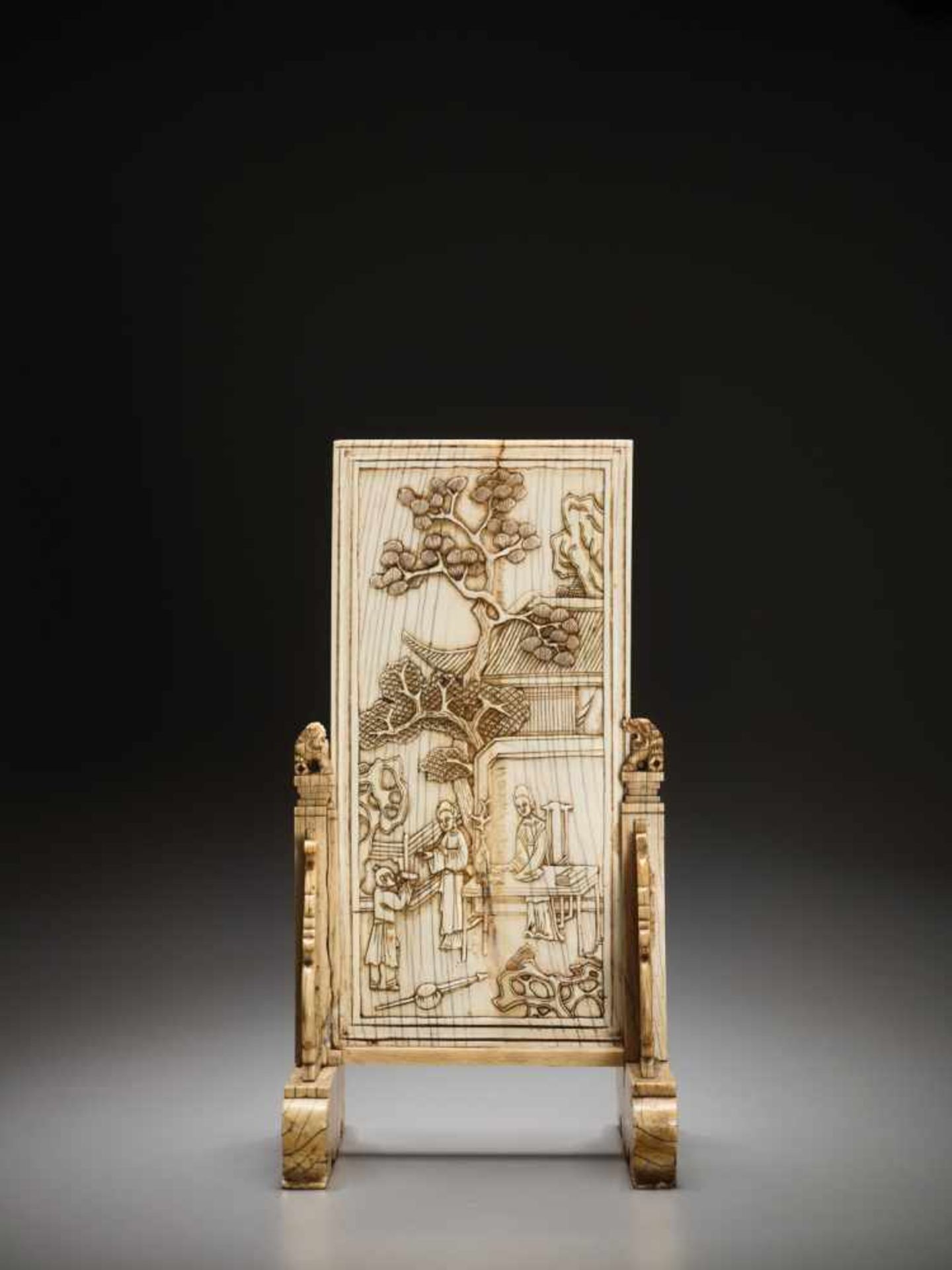 AN IVORY DOUBLE-SIDED ‘NARRATIVE’ TABLE SCREEN, KANGXI Artist signature on the stand. Ivory engraved