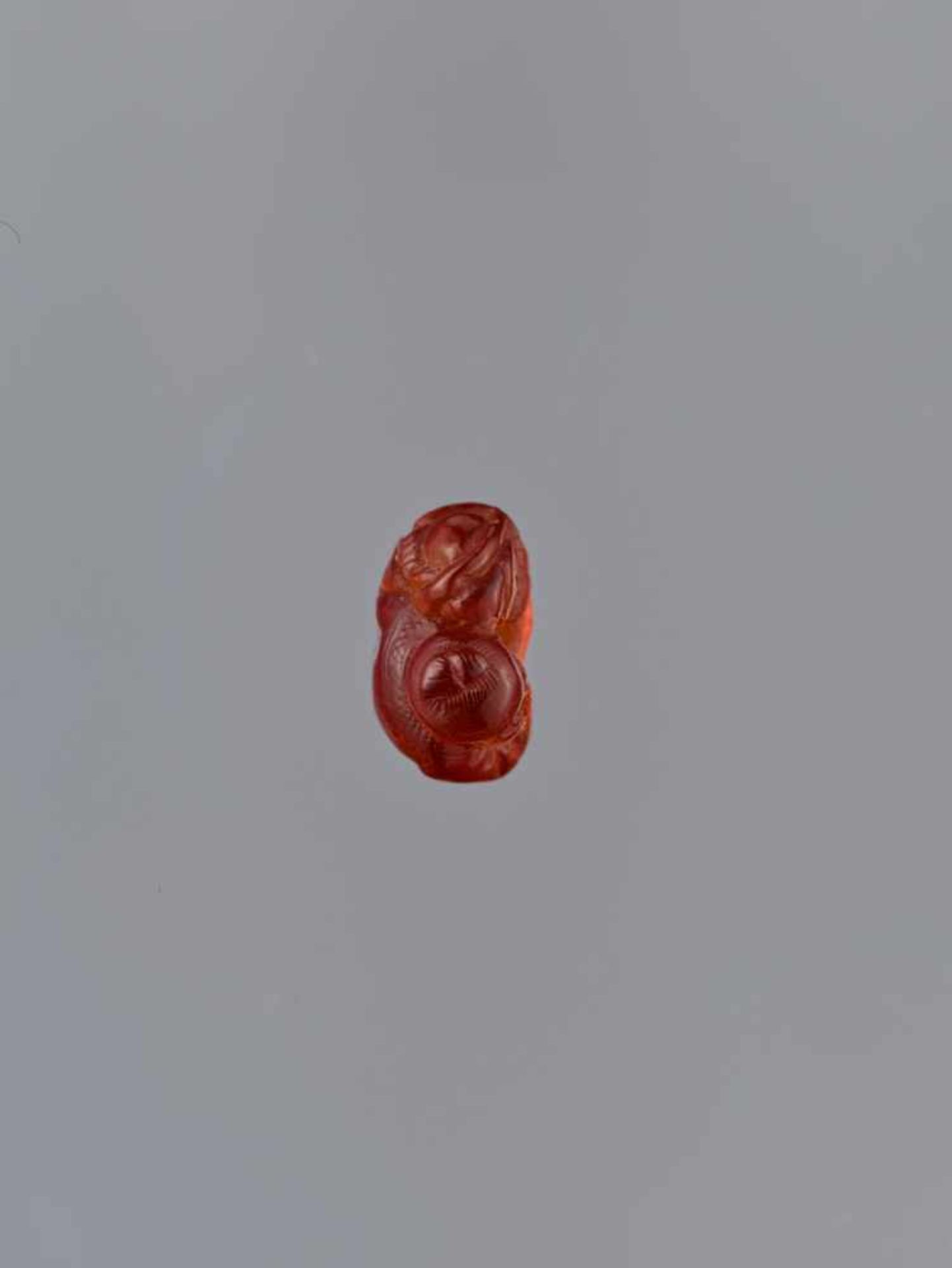 A QING DYNASTY AMBER CARVING OF BOY WITH BASKET Amber of bright orange color and of near translucent - Image 6 of 7