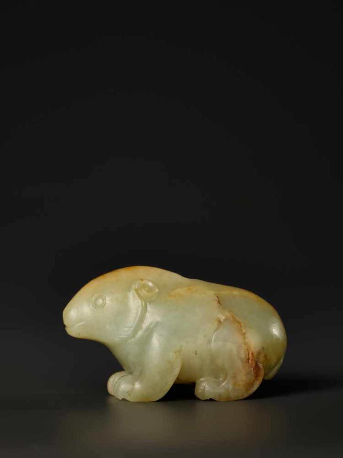 A SMALL CELADON AND RUSSET JADE CARVING OF A CROUCHING BEAR, XIONG, MING DYNASTY The mottled celadon - Image 7 of 8