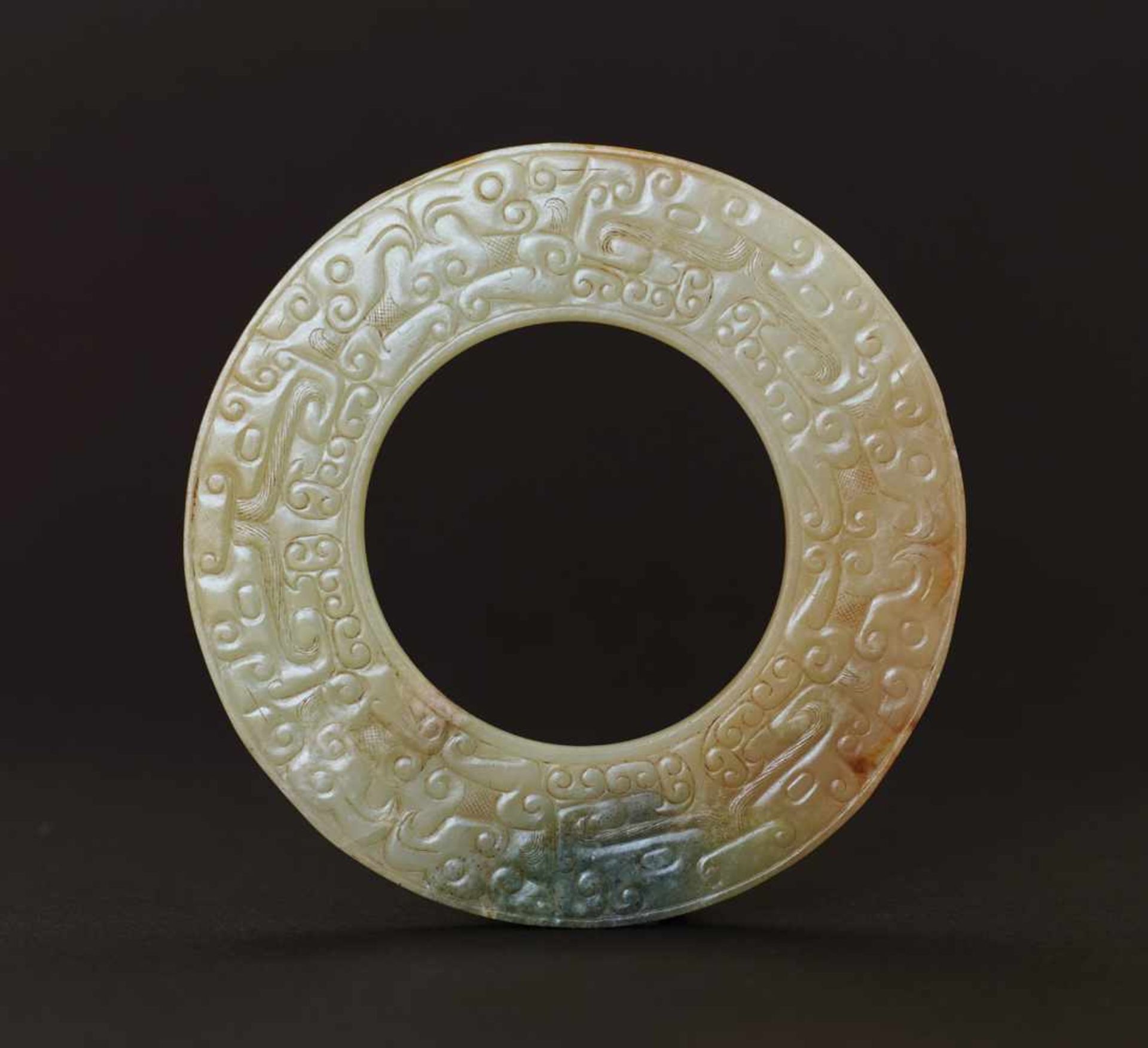 HUAN RING WITH ANIMAL MASKS AND BIRDS This jade is published in Filippo Salviati 4000 YEARS OF