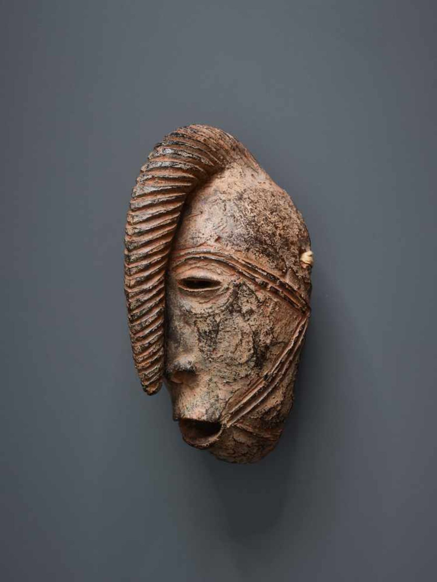 AFRICAN TRIBAL ART, A PASSPORT MASK OF A WARRIORTerracotta with black glaze in some - Image 3 of 4