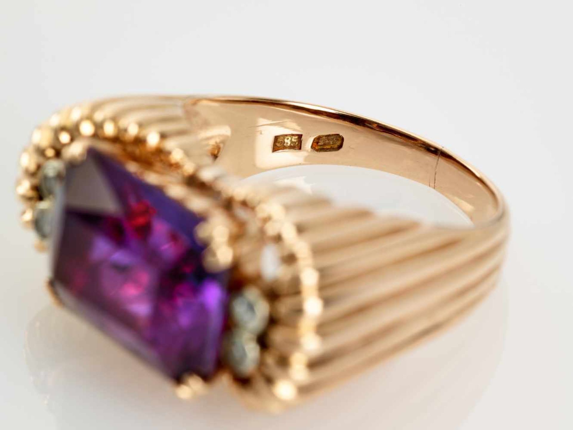 A DEEP PURPLE AMETHYST AND DIAMOND 14 CARAT PINK GOLD RINGAustriaAttributed to Erwin Paltscho, after - Image 5 of 7