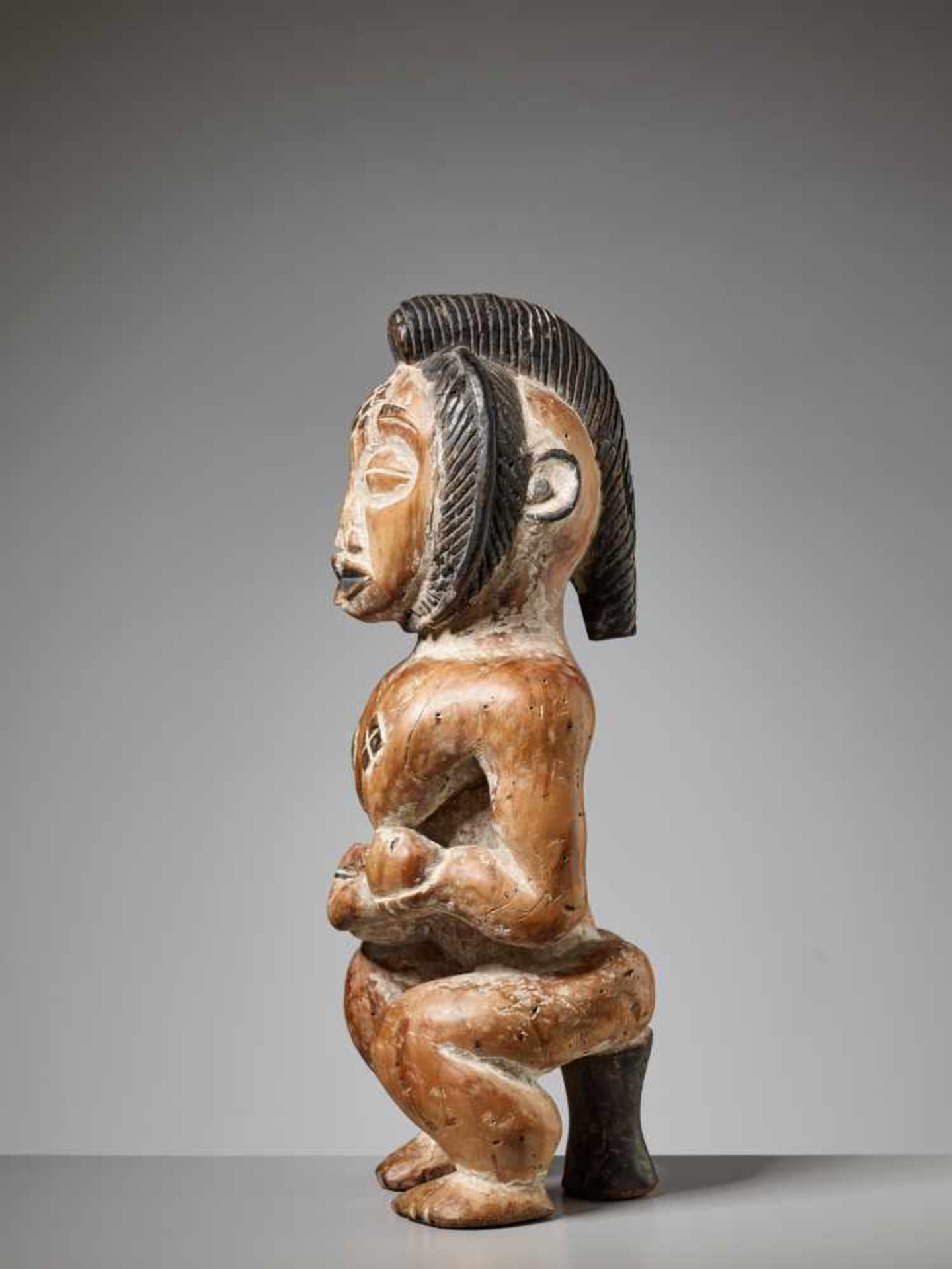 A WOOD MATERNITY FIGURE, GABON, PUNU PEOPLEPainted wood, kaolinGabon, Punu people20th centuryThe - Image 4 of 6