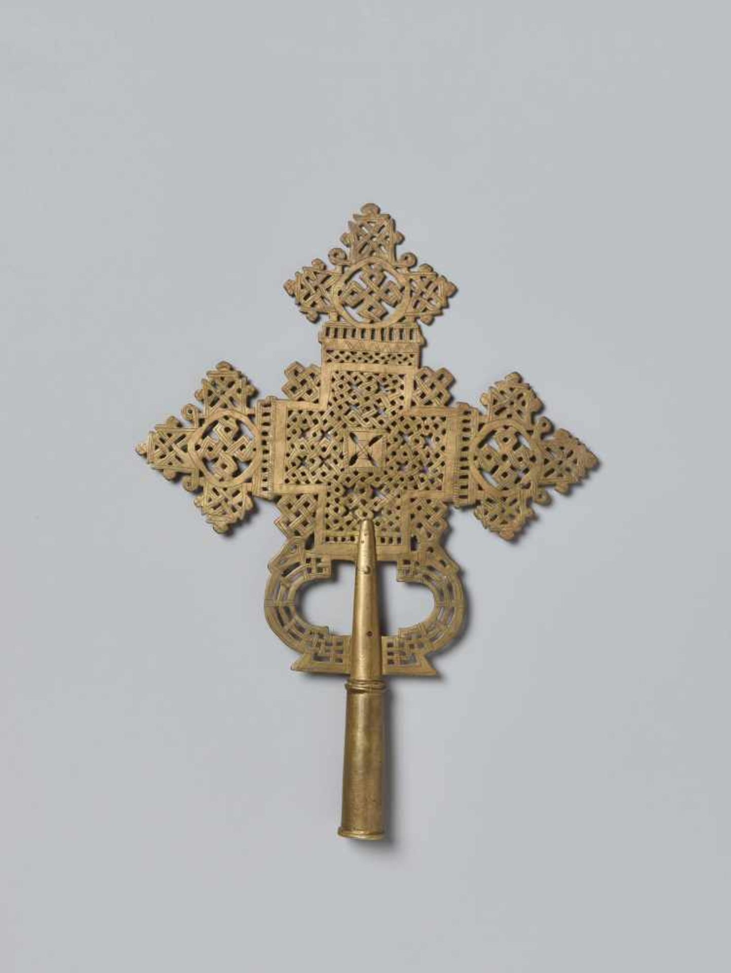 A PROCESSIONAL CROSS, CHASED AND OPENWORKED BRASS, ETHIOPIA, 19TH CENTURYBrass, copper