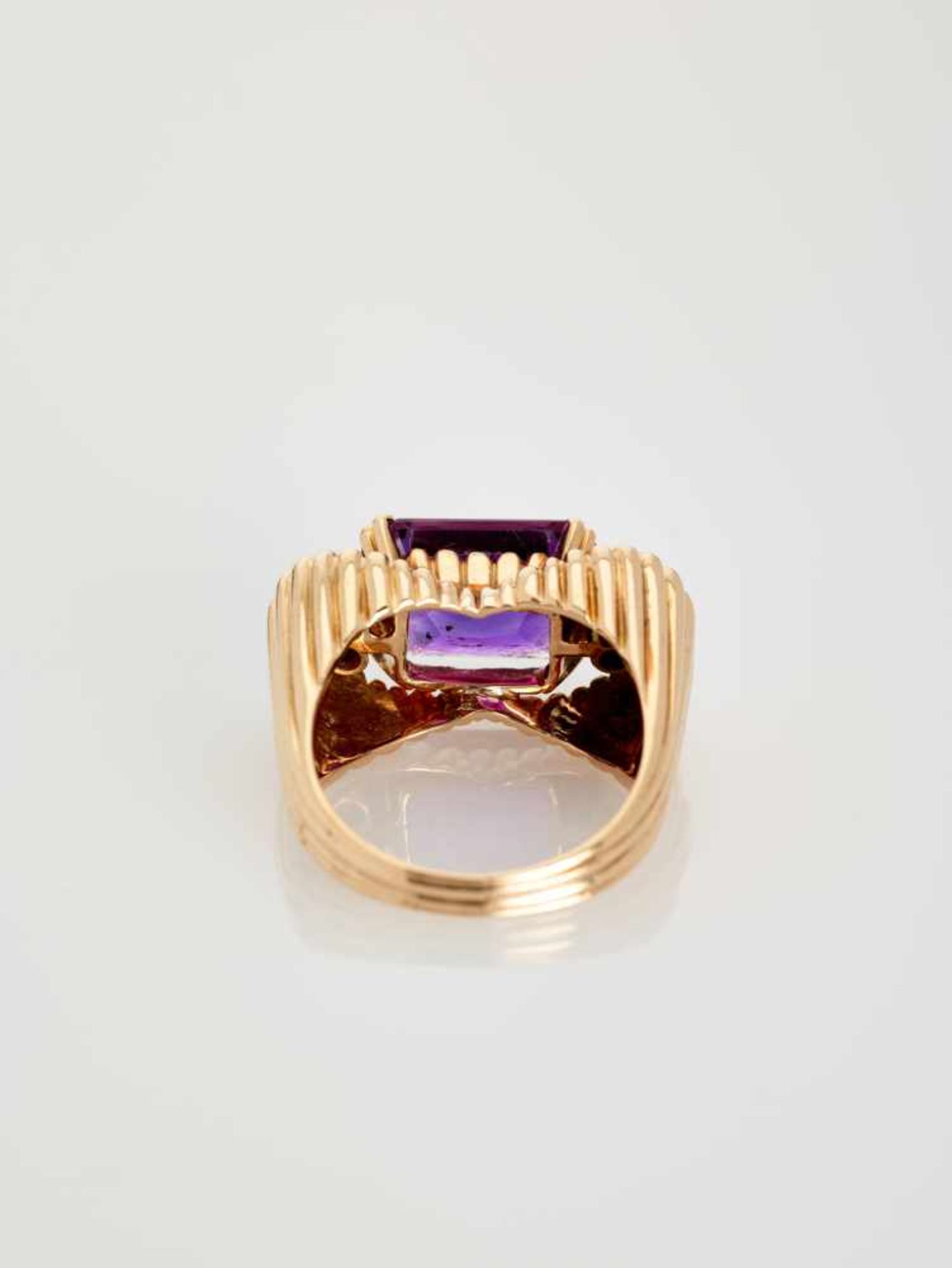 A DEEP PURPLE AMETHYST AND DIAMOND 14 CARAT PINK GOLD RINGAustriaAttributed to Erwin Paltscho, after - Image 4 of 7