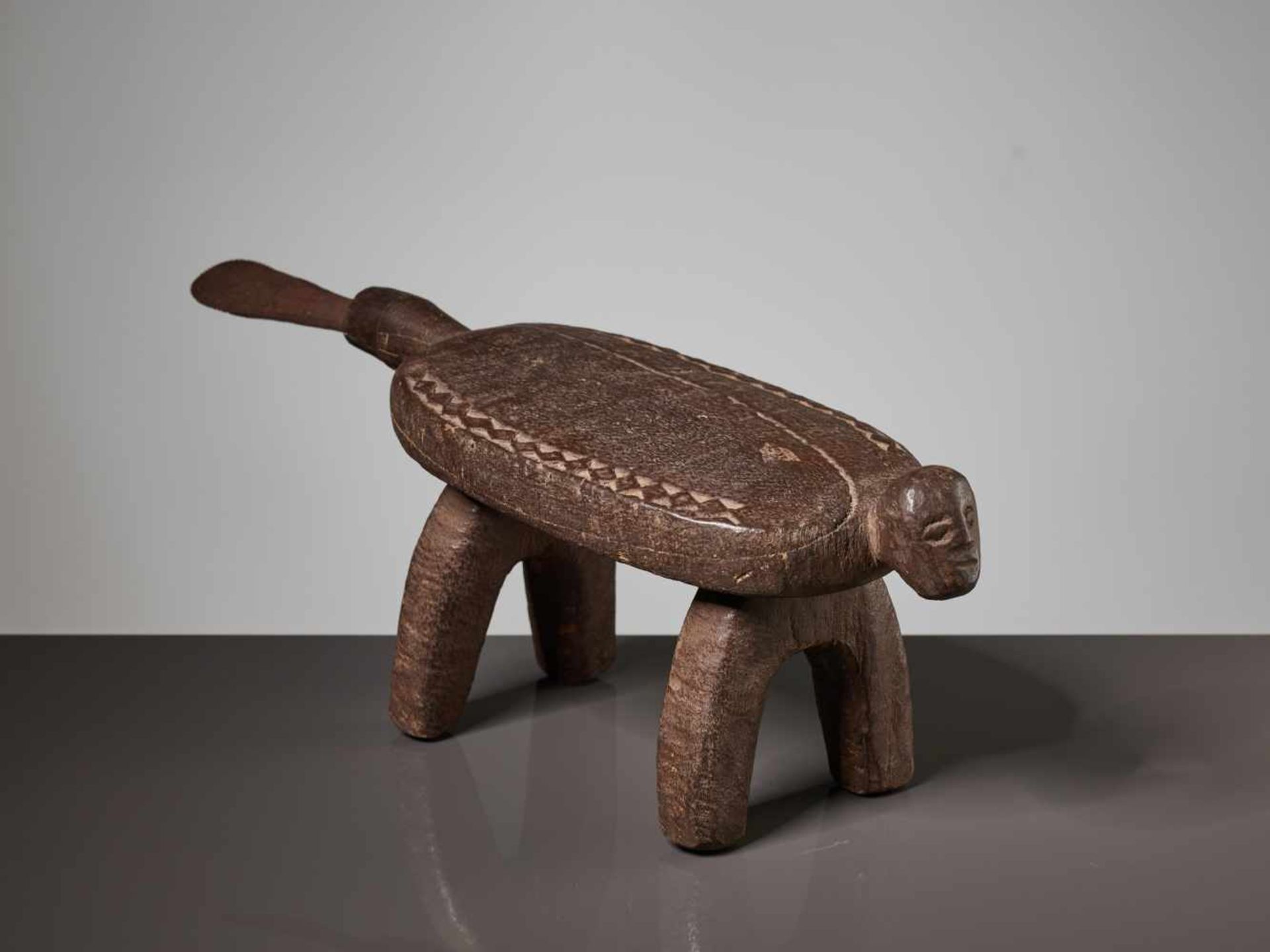 A WOODEN STOOL WITH A HUMAN FACE, BURKINA FASO, LOBI PEOPLEBrown painted wood, iron bladeBurkina - Image 7 of 8