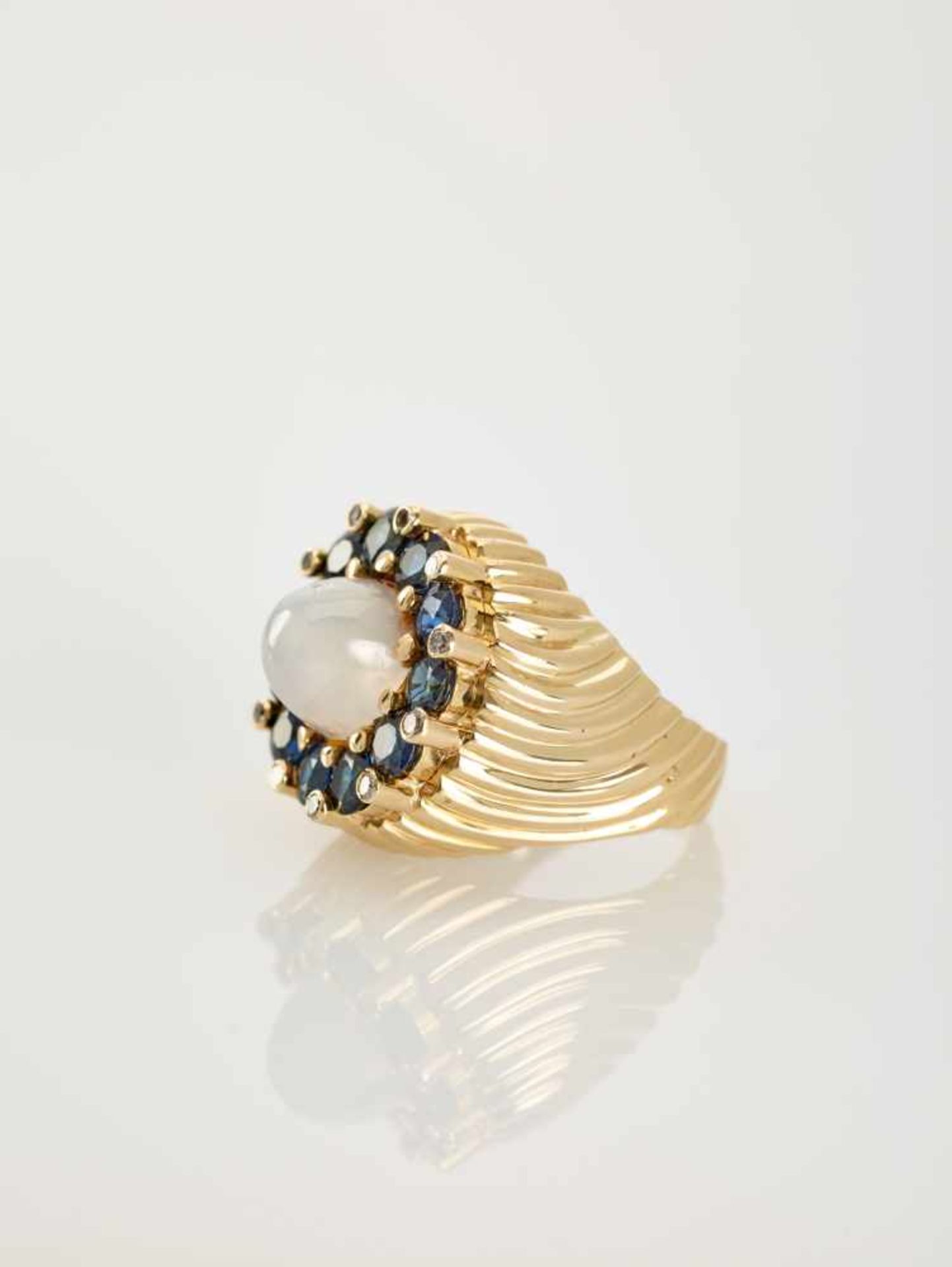 A SAPPHIRE, DIAMOND AND MOONSTONE YELLOW GOLD COCKTAIL RING BY PALTSCHOAustriaErwin Paltscho,