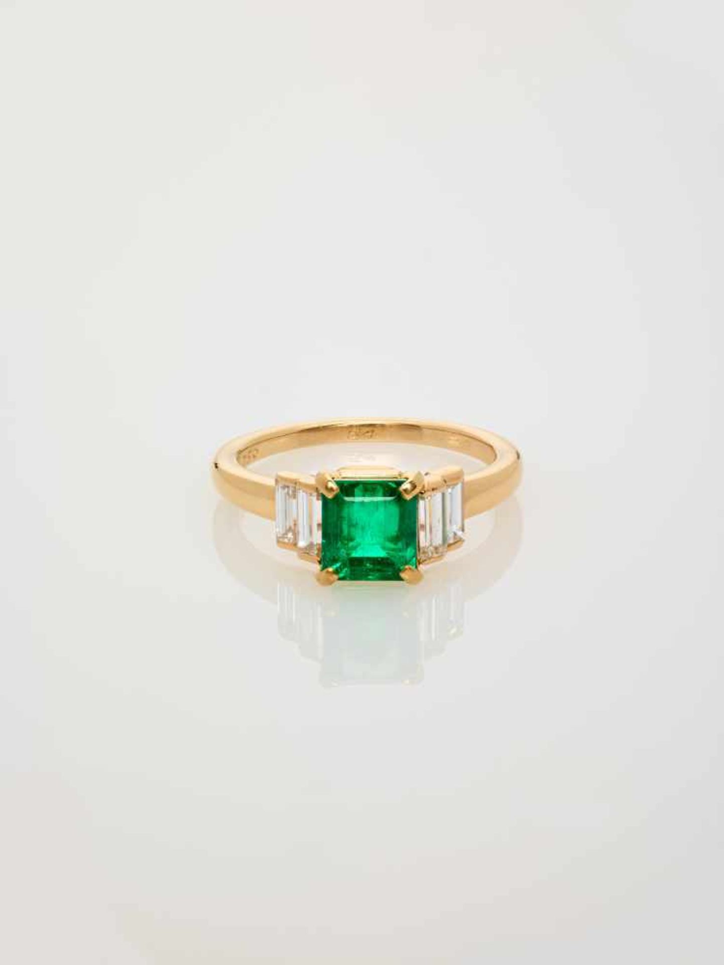 AN IMPORTANT CARTIER EMERALD AND DIAMOND RING Franceca. 1990, signed ‘Cartier’, assay ‘750’, numbers