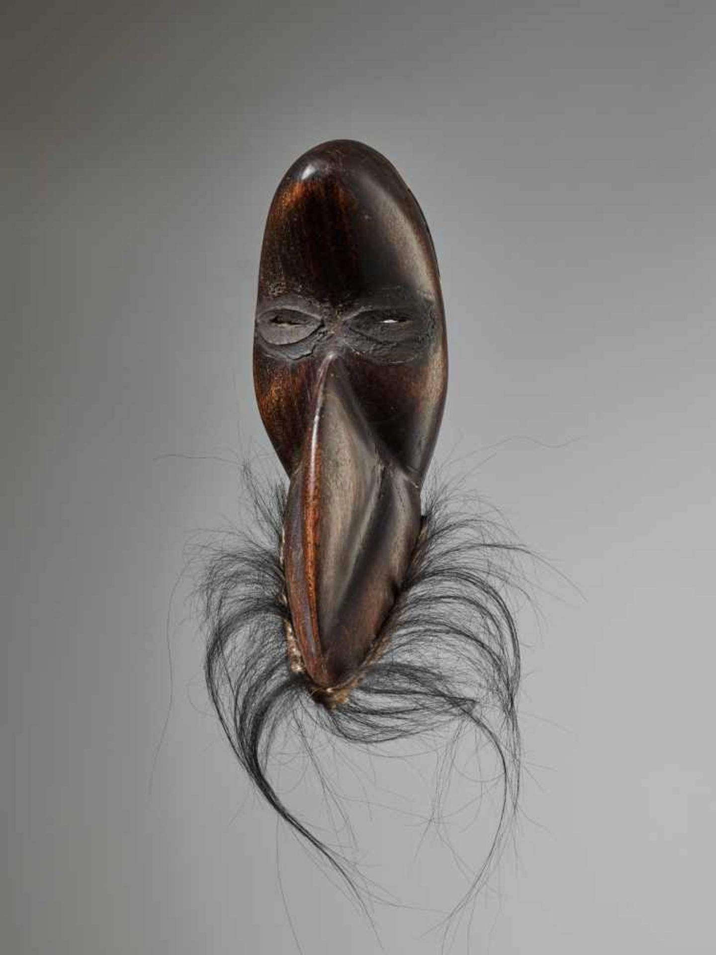 A PASSPORT GÄGON BIRD MASK, CÔTE D‘IVOIRE / LIBERIA, DAN PEOPLEWood with painted metal, black ape