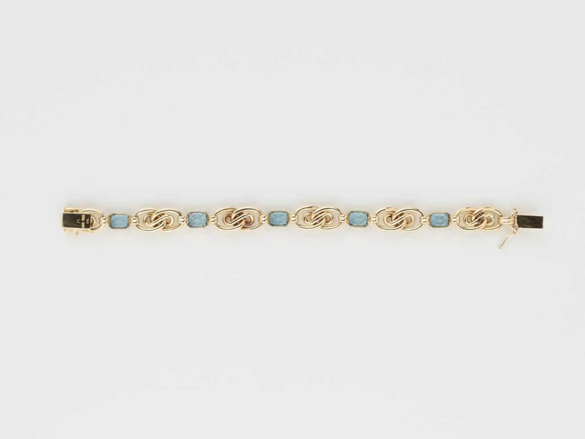 AN 18 CARAT AQUAMARINE AND YELLOW GOLD ‘ETERNITY KNOT’ BRACELETGermanyby F.J. Schröder Jewelers of - Image 7 of 9