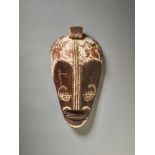 A NGIL MASK, GABON / CAMEROON / EQUATORIAL GUINEA, FANG PEOPLEPainted wood, kaolin, leather