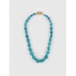 A NECKLACE WITH LARGE TURQUOISE BEADS AND 18 CARAT GOLD CLASPGold clasp with various Austrian