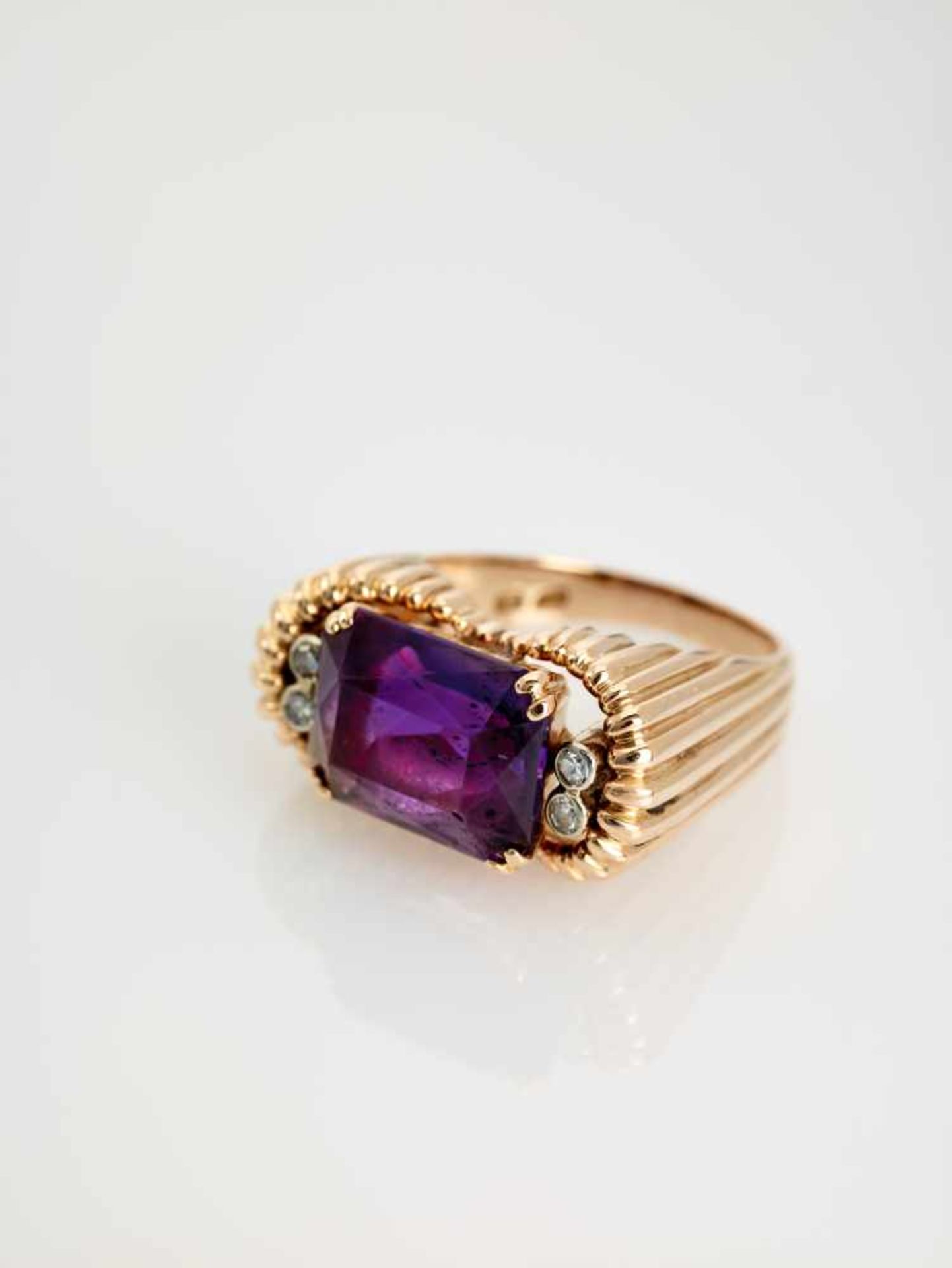 A DEEP PURPLE AMETHYST AND DIAMOND 14 CARAT PINK GOLD RINGAustriaAttributed to Erwin Paltscho, after - Image 6 of 7