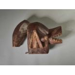 A SUAGA MASK, CAMEROON / NIGERIA, MAMBILA PEOPLEPainted wood, leather stringCameroon / Nigeria,