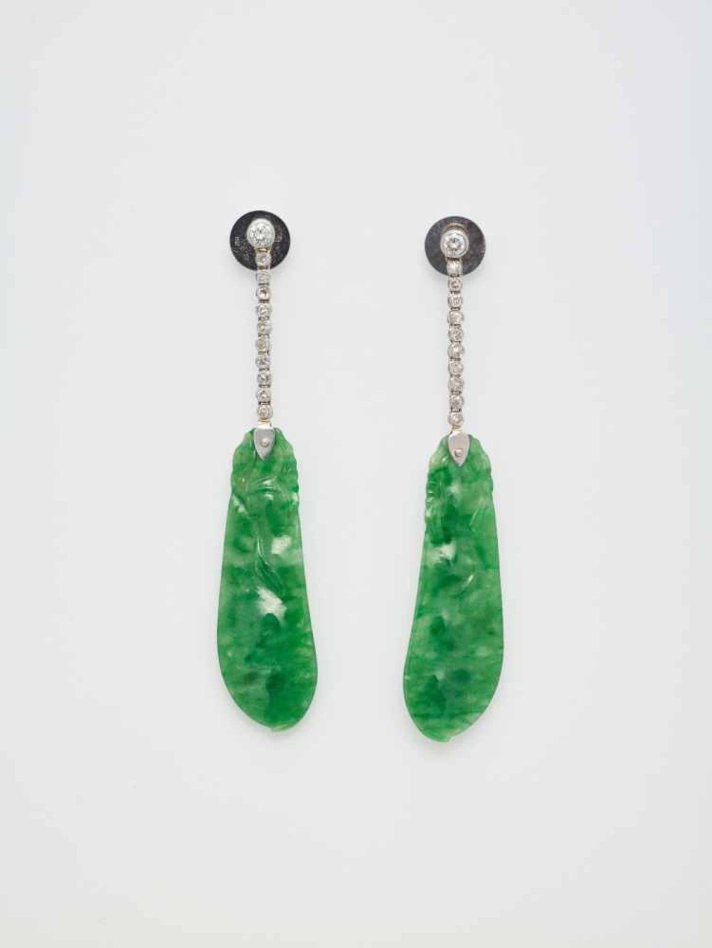 A PAIR OF APPLE GREEN JADE AND DIAMOND PENDANT EARRINGSpossibly Frenchafter 1930, marked ‘750’Each