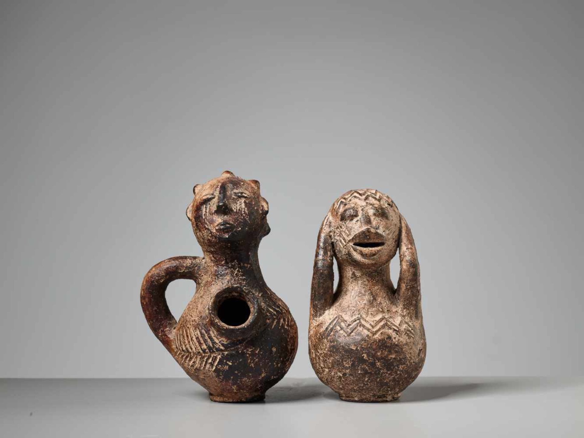AFRICAN TRIBAL ART, A PAIR OF FIGURAL TERRACOTTA VESSELSTerracotta with earthy glazeAfrica1st half