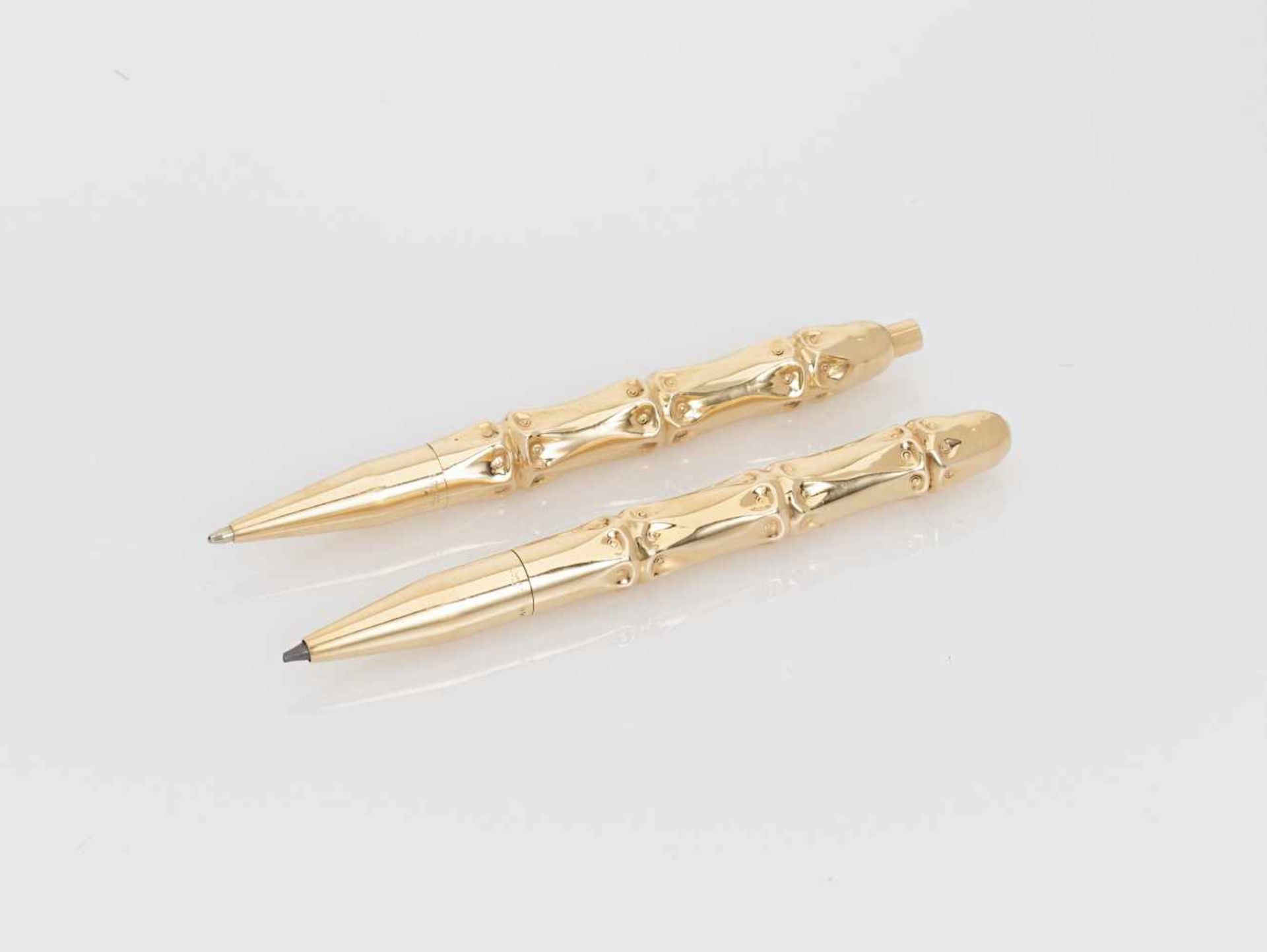 A VINTAGE CARTIER PEN AND PROPELLING PENCIL SET, 14 CARAT GOLD, ca. 1950New York, USAeach with