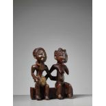 A PAIR OF ANCESTRAL FIGURES, NIGERIA, YORUBA PEOPLEWood, fur, and glass beadsNigeria, Yoruba