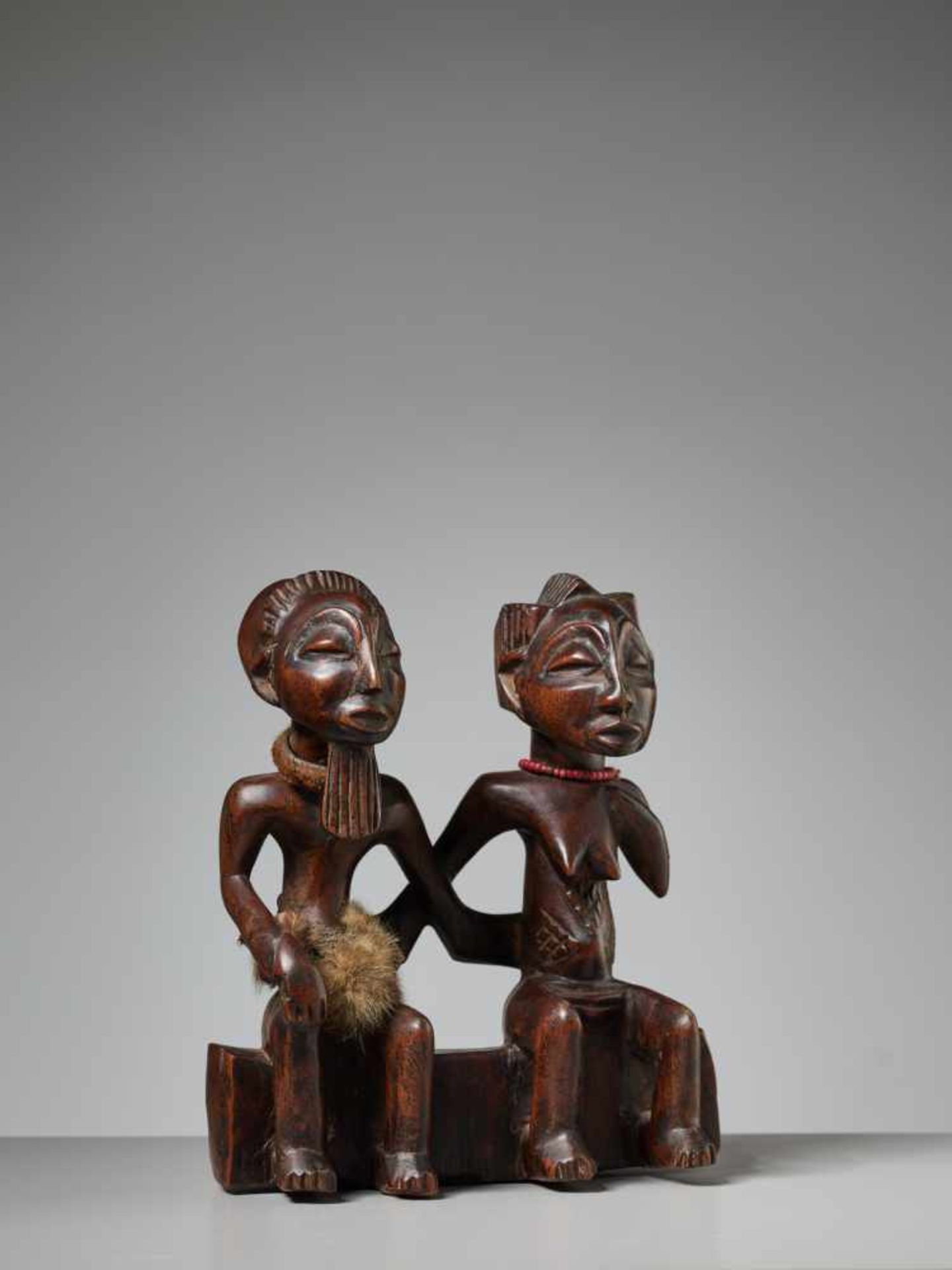 A PAIR OF ANCESTRAL FIGURES, NIGERIA, YORUBA PEOPLEWood, fur, and glass beadsNigeria, Yoruba