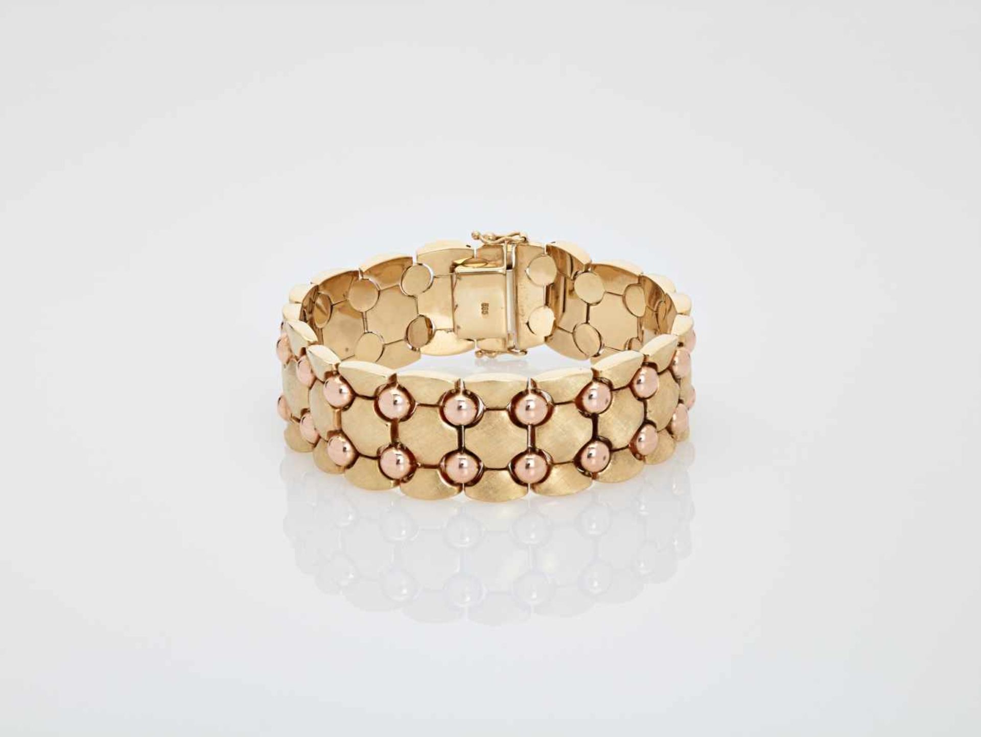 A 1950s YELLOW AND PINK GOLD ‘MOON’ BRACELETItalyafter 1950, stamped hallmark ‘585’Safety lock