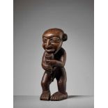 A WOOD STATUE OF A MEDICINE MAN, NIGERIA, YORUBA PEOPLEWood, animal horn pendantNigeria, Yoruba