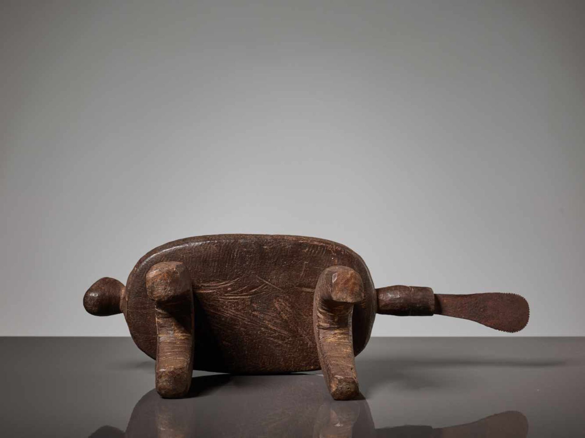 A WOODEN STOOL WITH A HUMAN FACE, BURKINA FASO, LOBI PEOPLEBrown painted wood, iron bladeBurkina - Image 8 of 8