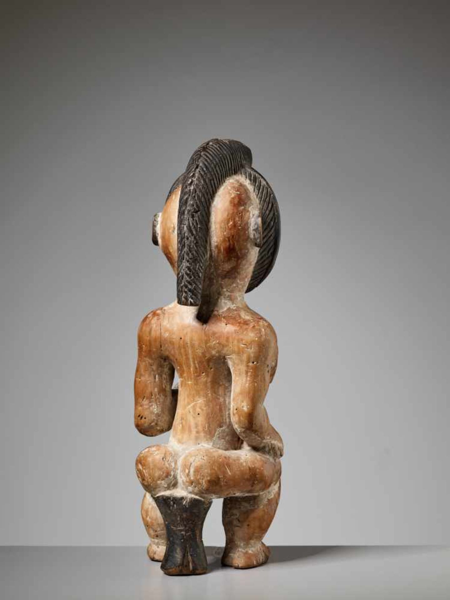 A WOOD MATERNITY FIGURE, GABON, PUNU PEOPLEPainted wood, kaolinGabon, Punu people20th centuryThe - Image 5 of 6