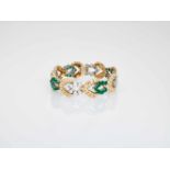 A VAN CLEEF & ARPELS GOLD BRACELET WITH 11 CARATS OF EMERALDS AND DIAMONDSNew Yorkca. 1940,