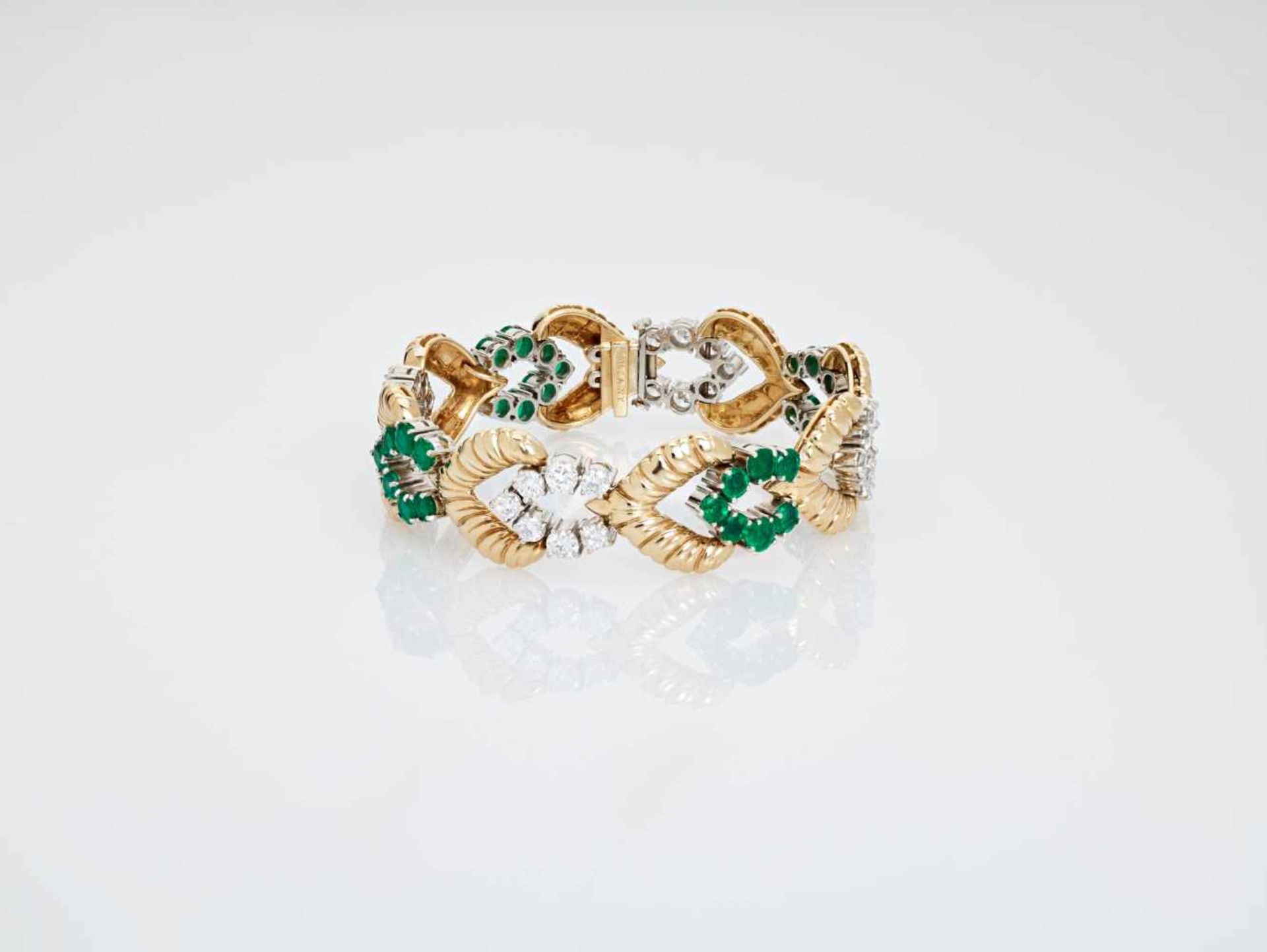 A VAN CLEEF & ARPELS GOLD BRACELET WITH 11 CARATS OF EMERALDS AND DIAMONDSNew Yorkca. 1940,