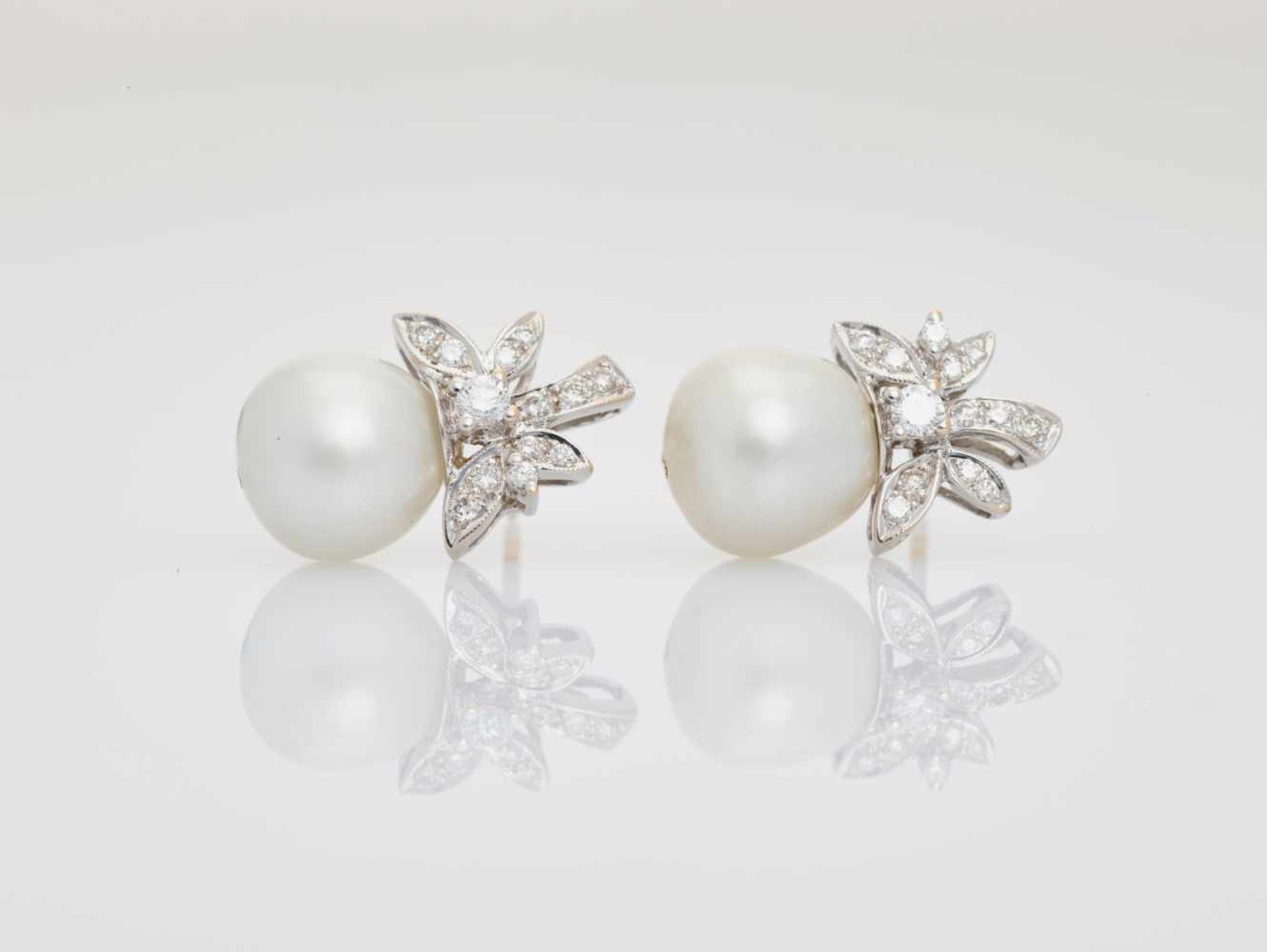 A PAIR OF WHITE GOLD, DIAMOND AND SOUTH-SEA PEARL EARRINGSPossibly Frenchafter 1930, each marked ‘