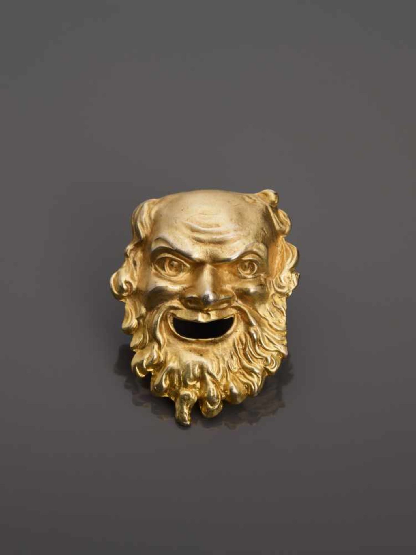 A GOLD-PLATED SILVER BROOCH IN SHAPE OF A LAUGHING ROMAN GOD, 1930sAustria1930s, hallmarked ‘835’