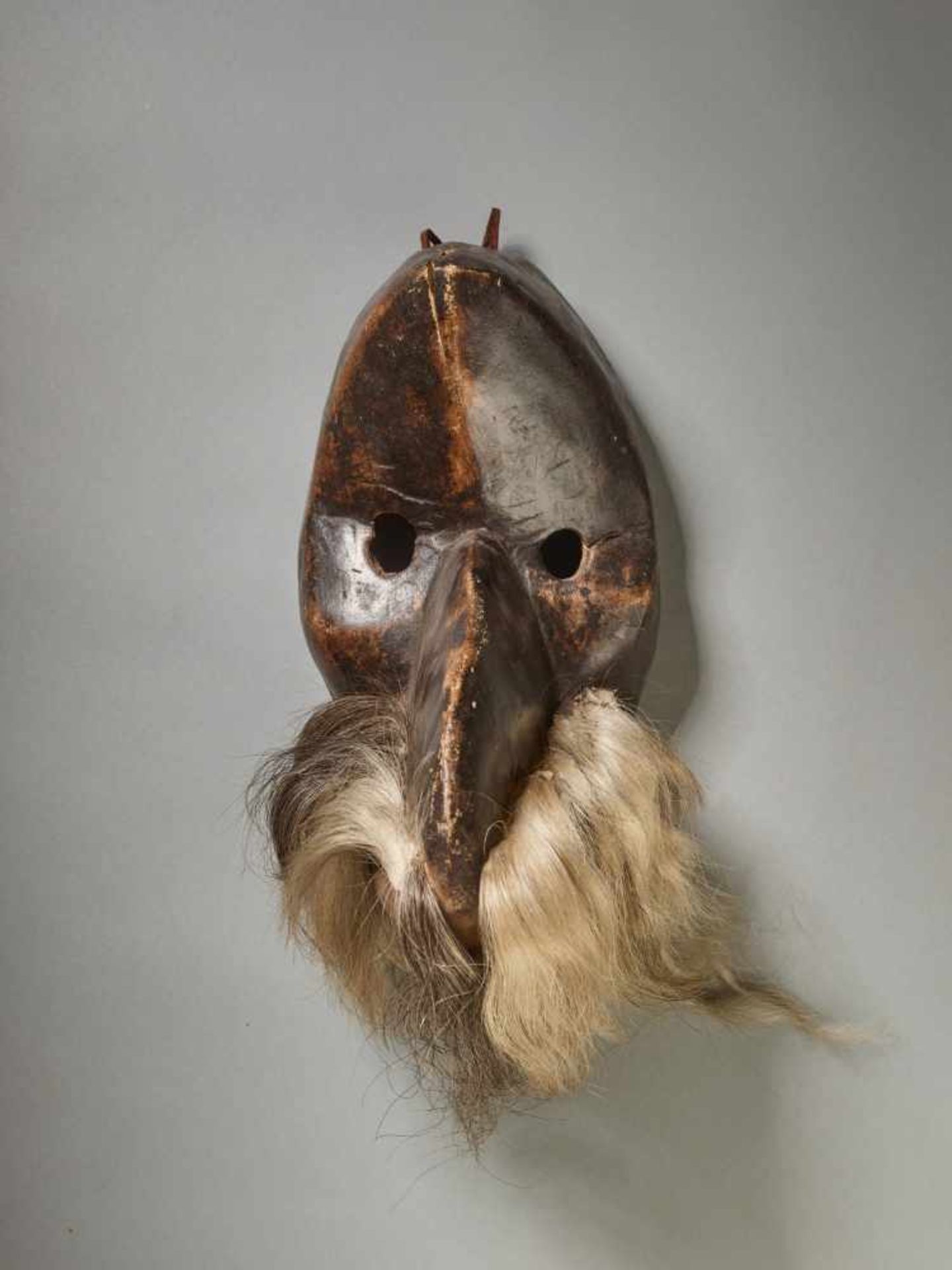 A GÄGON BIRD MASK, CÔTE D’IVOIRE / LIBERIA, DAN PEOPLEWood with painted metal, black ape hair, - Image 2 of 5