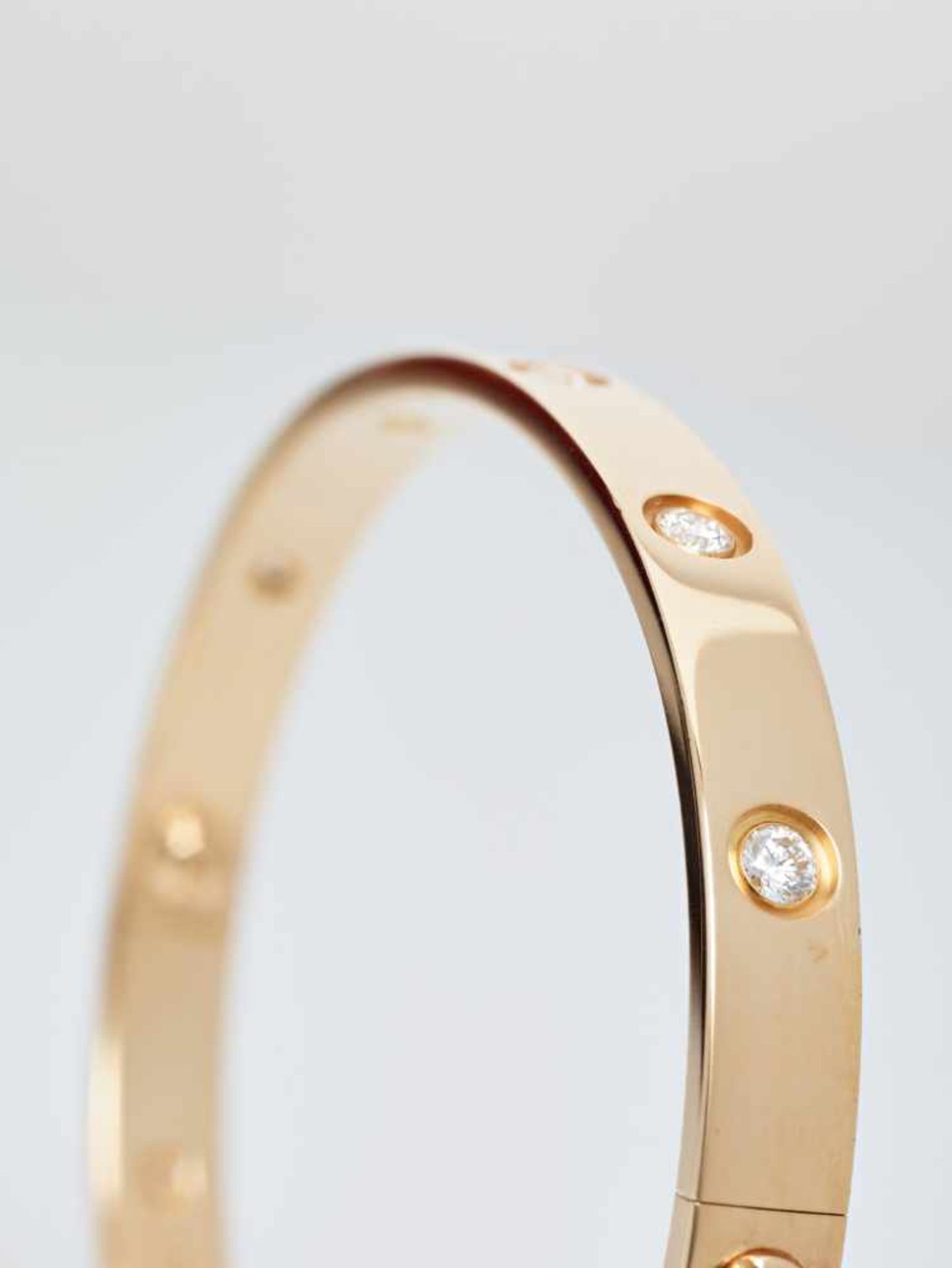 A CARTIER 18 CARAT GOLD ‘LOVE’ BANGLE WITH 1.2 CARATS OF DIAMONDSFrance2007, signed ‘Cartier’, - Image 6 of 9