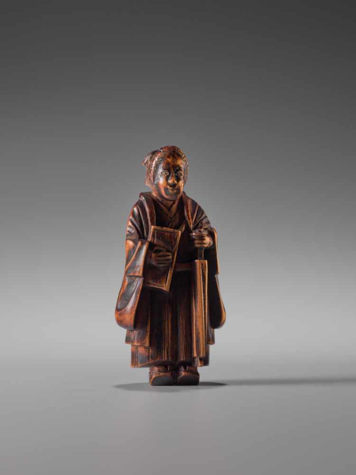 A WOOD NETSUKE OF A LADY WITH BOOK AND UMBRELLAWood netsukeJapan1st half of 19th century, Edo period - Image 5 of 6