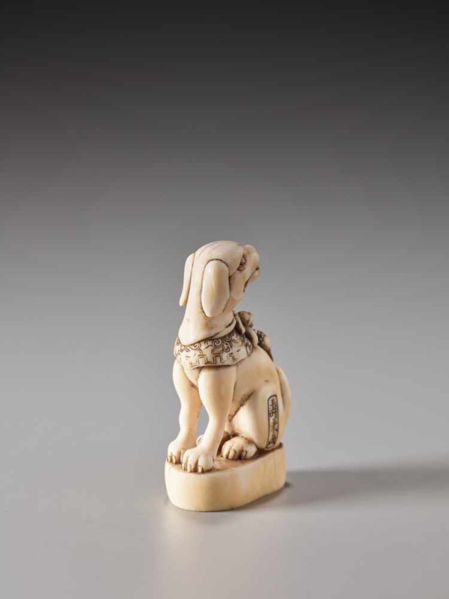 A FINE IVORY SEAL NETSUKE OF A DOG WITH COLLAR AND BELL BY TOSHIHIDE (JUEI)Ivory netsukeJapan19th - Image 4 of 7