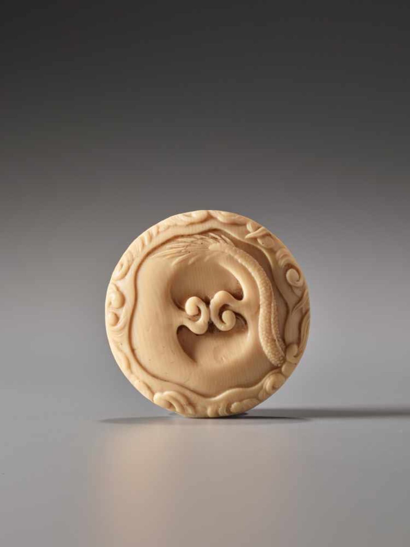 A FINE IVORY MANJU NETSUKE OF A SKY DRAGON ATTRIBUTED TO OKUTAKAIvory manju netsukeJapan19th - Image 2 of 5