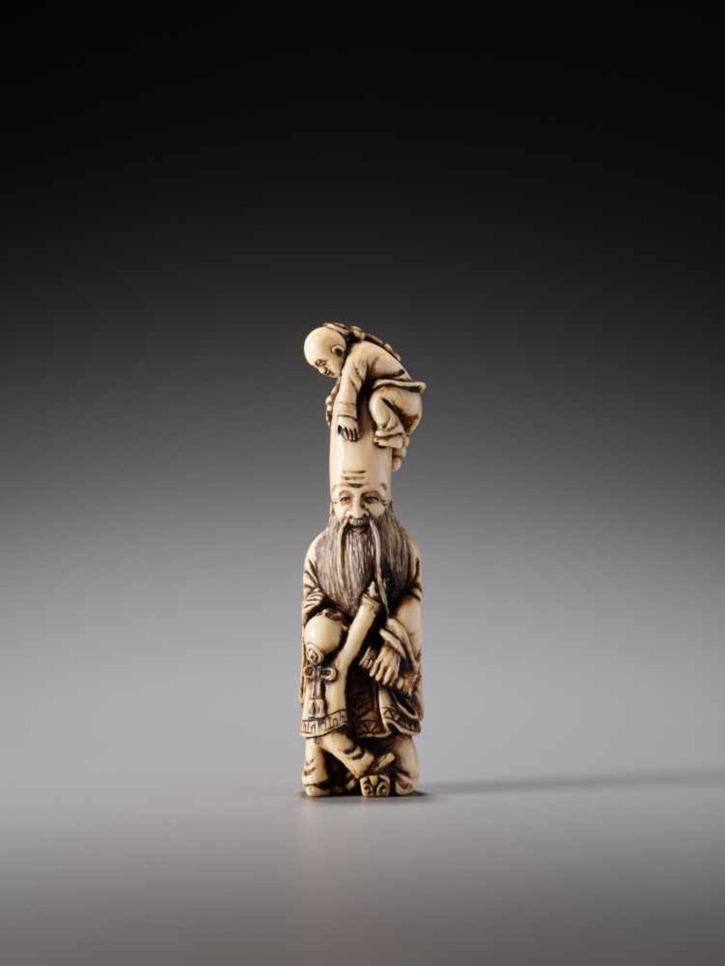 AN IVORY NETSUKE OF FUKUROKUJU AND TWO KARAKO BY SHOZANIvory netsukeJapan19th century, Edo period (