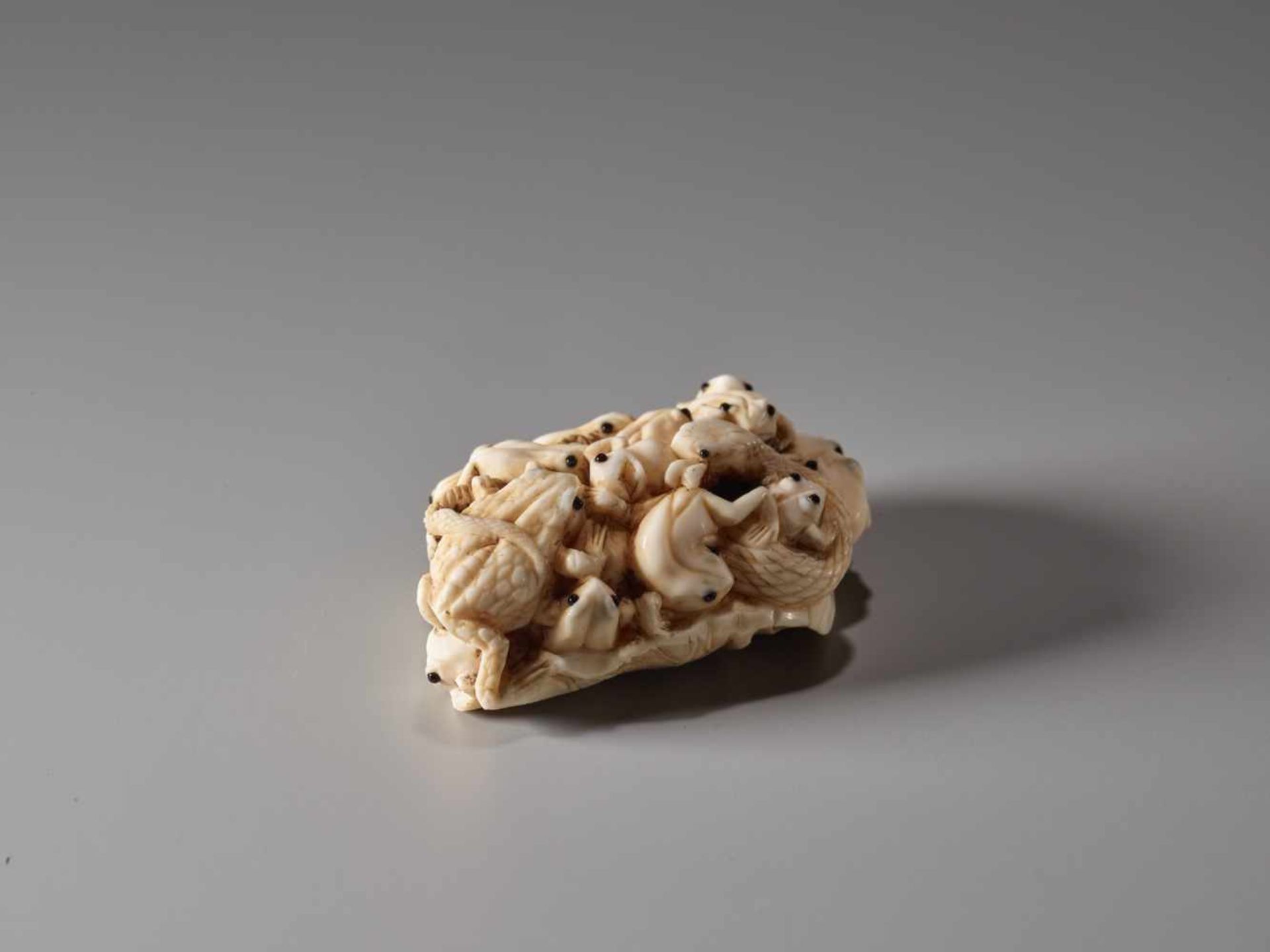 AN IVORY NETSUKE OF MANY TOADS ON A LOTUS LEAF BY MASAMITSUIvory netsukeJapanlate 19th century, - Image 2 of 7