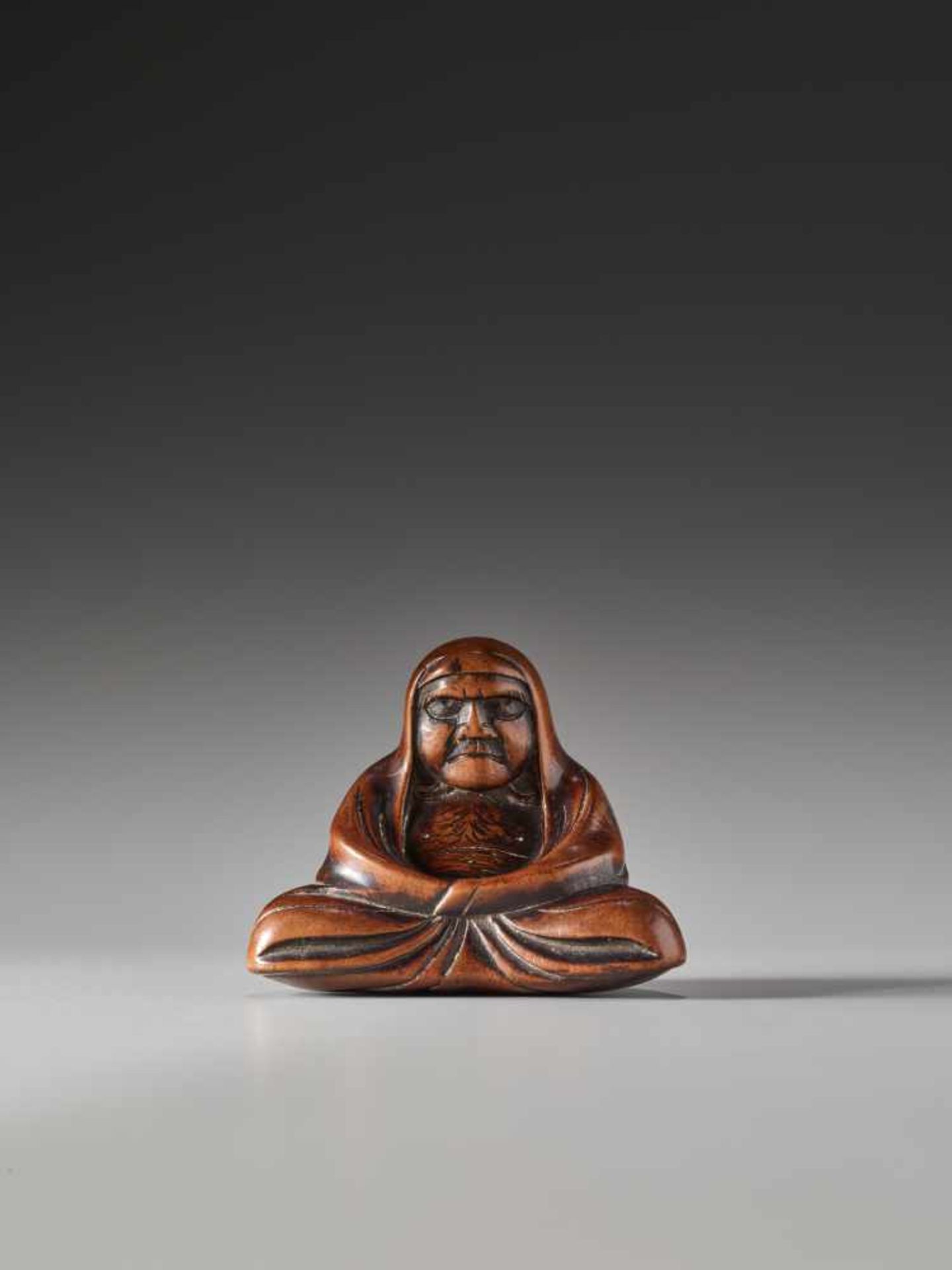 A WOOD NETSUKE OF DARUMAWood netsukeJapan19th century, Edo period (1615-1868)The first patriarch