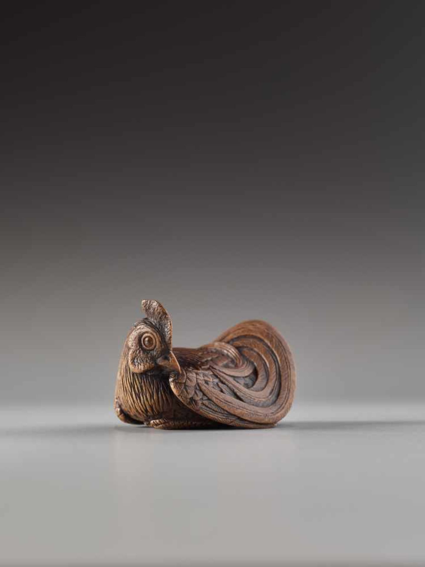 A FINE AND SMALL WOOD NETSUKE OF A RECUMBENT COCKEREL BY HOKYUDO ITSUMINWood netsukeJapan, Edomid- - Image 8 of 10