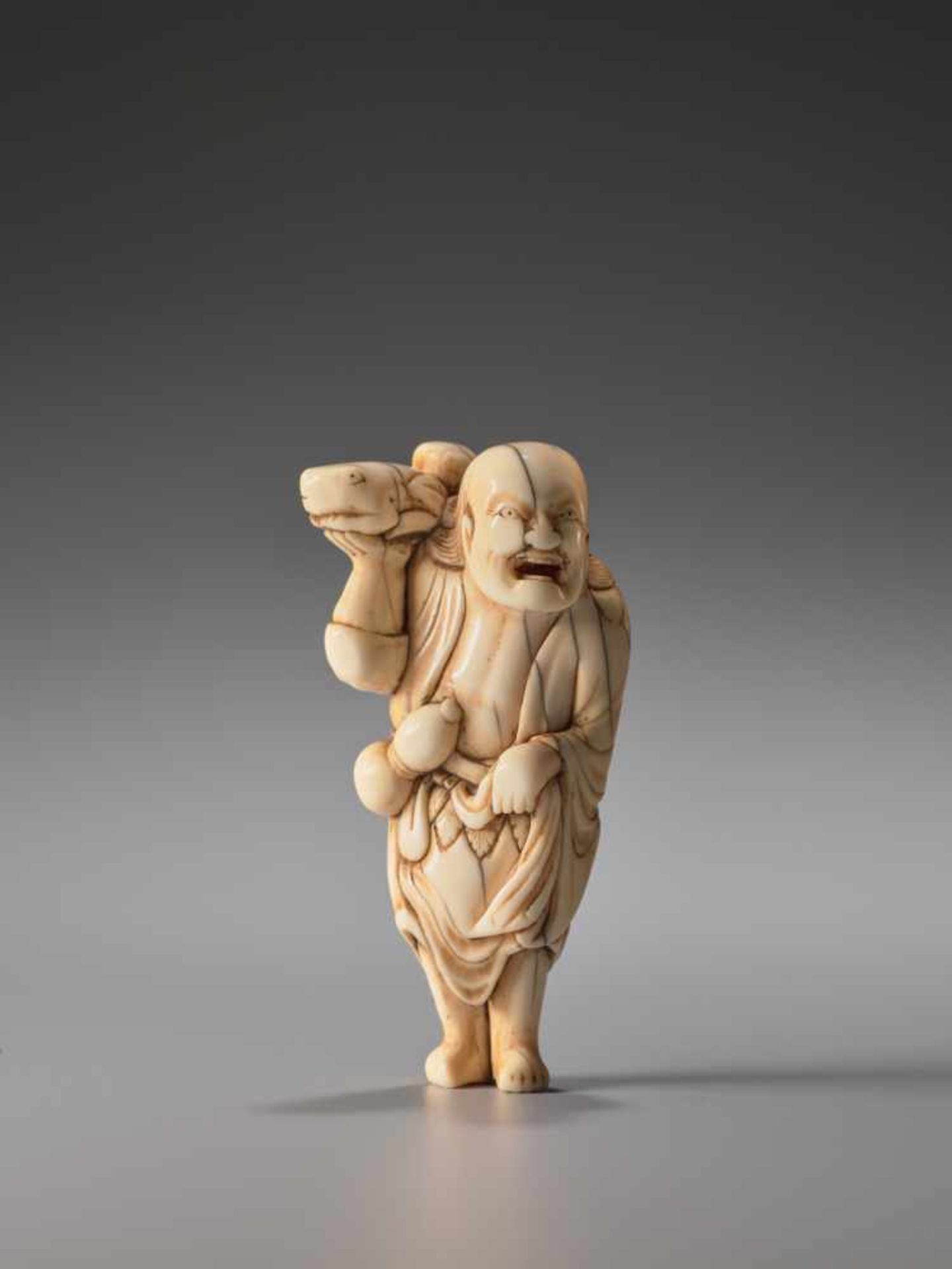 A POWERFUL IVORY NETSUKE OF GAMA SENNINIvory netsukeJapan18th century, Edo period (1615-1868)The