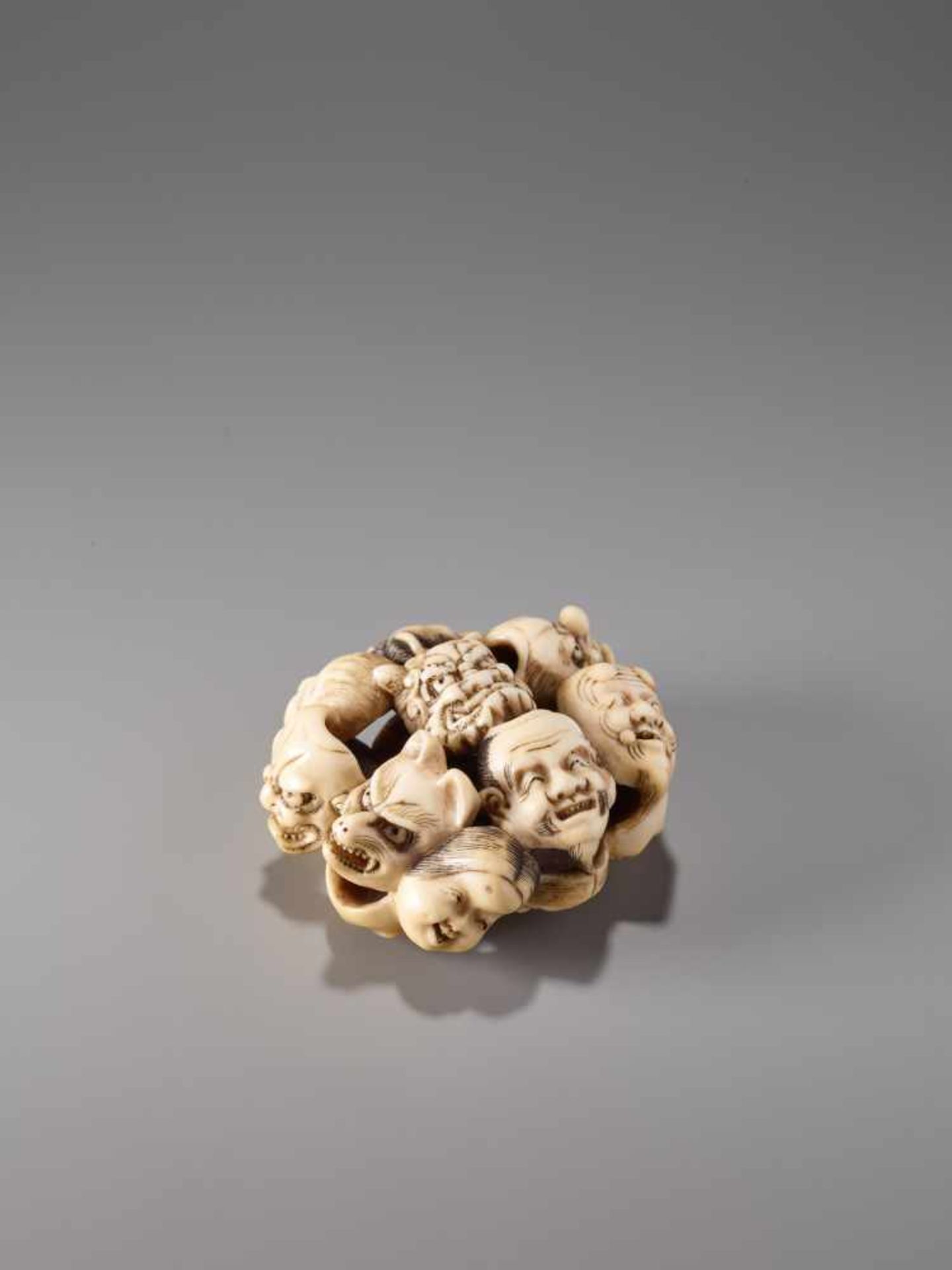 AN IVORY ‘RYUSA-STYLE’ MANJU NETSUKE DEPICTING FIFTEEN NOH MASKS BY ICHIJO HAKUUNSAI IIIvory