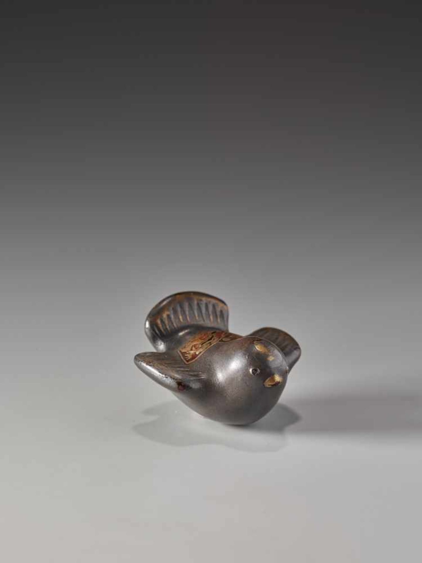 A SMALL AND RARE LACQUERED WOOD NETSUKE OF A CHIDORILacquered wood netsukeJapan19th century, Edo