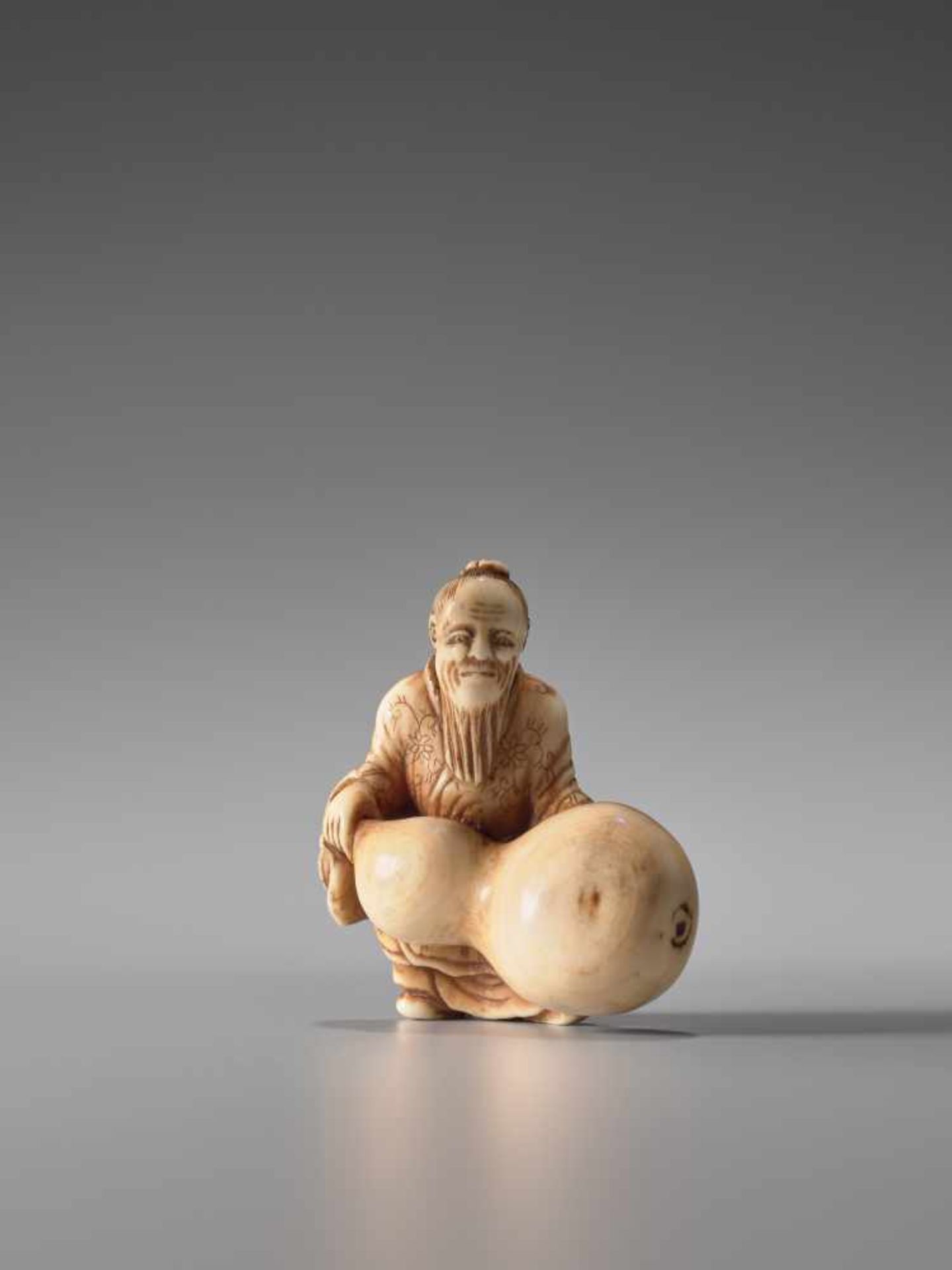 A SMALL IVORY NETSUKE OF CHOKARO SENNIN WITH GIANT HYOTANIvory netsukeJapanlate 19th century,